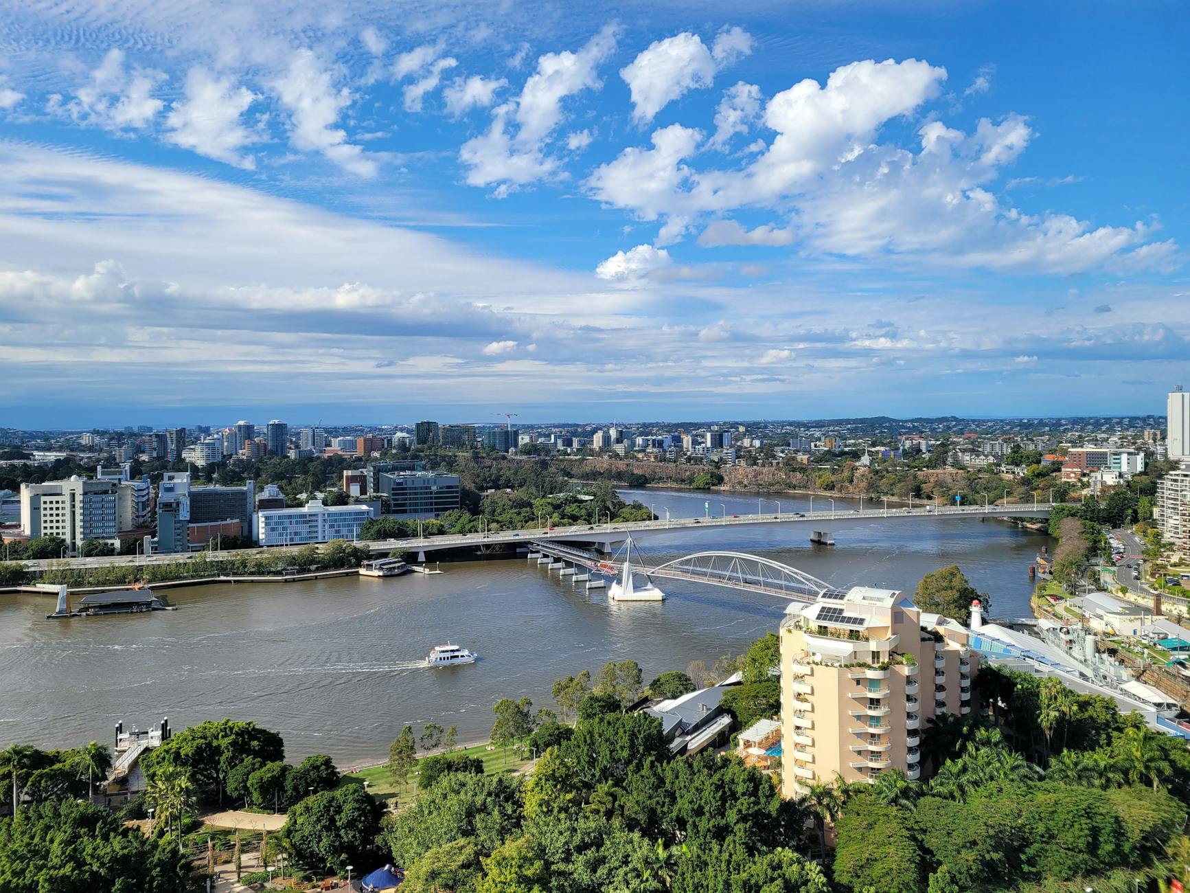 Aerial Brisbane river and bridges for solo meal district planning.