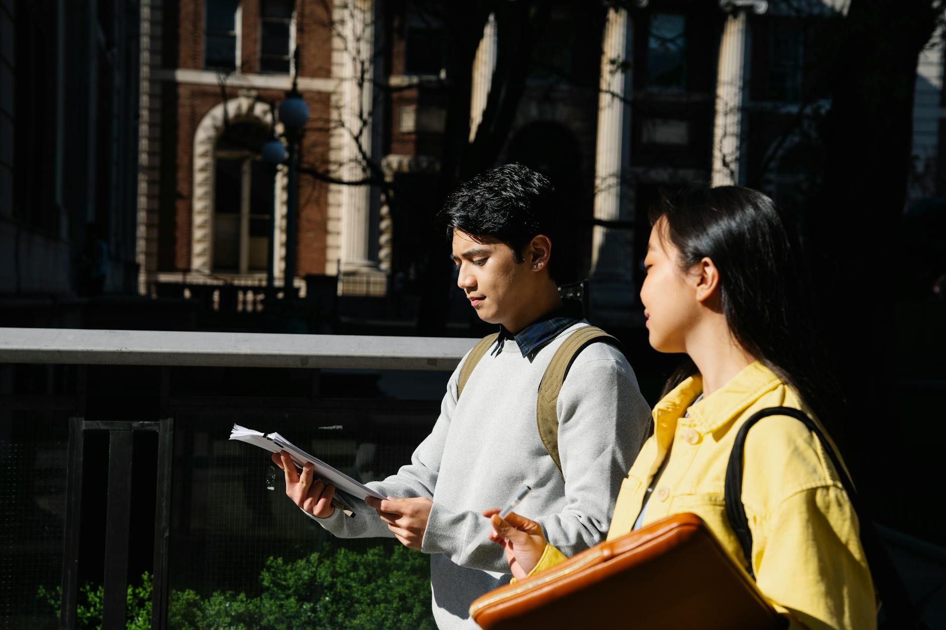 Students walking with notes for Brisbane orientation planning.