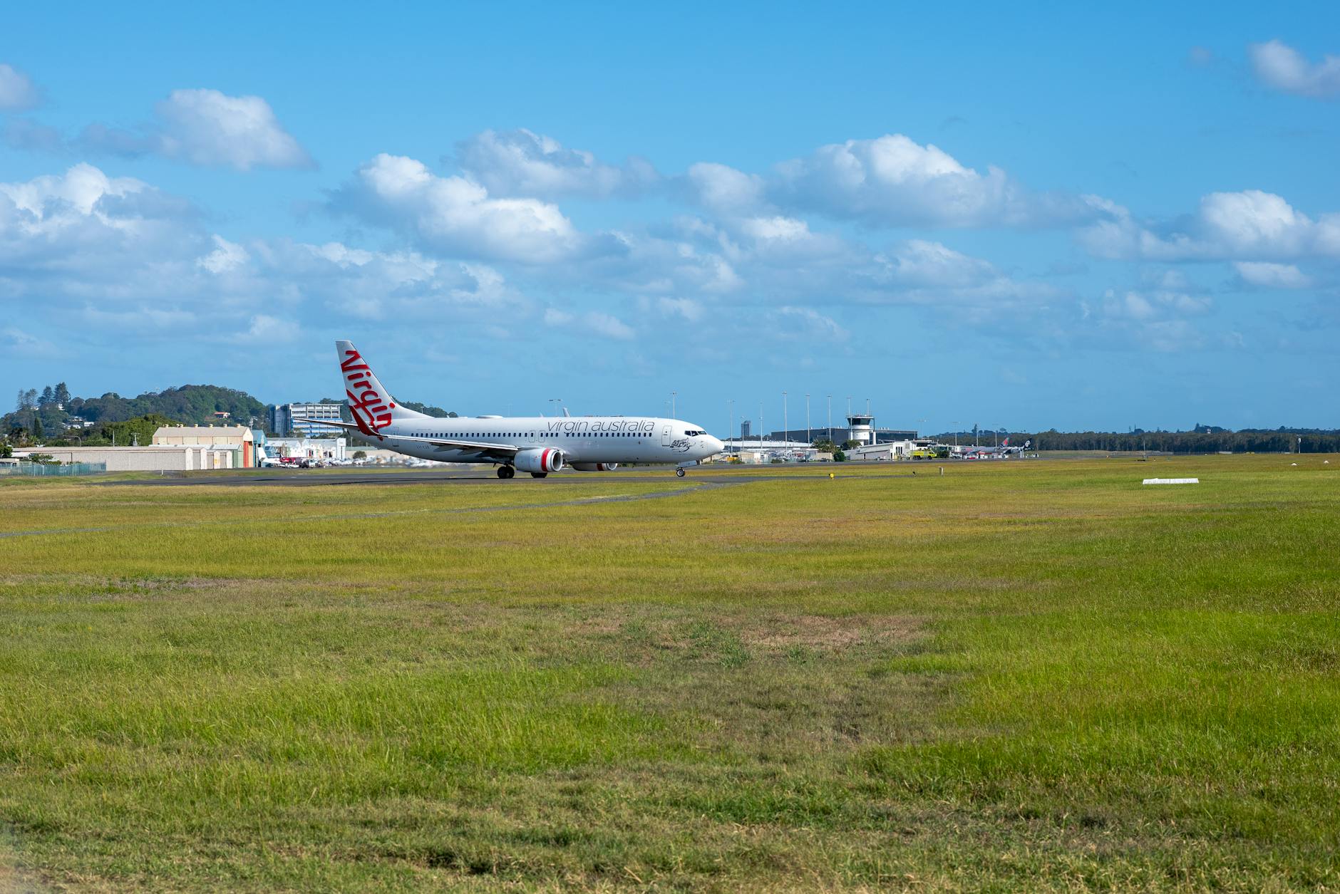 Virgin aircraft at Gold Coast Airport for Brisbane connection timing decisions.