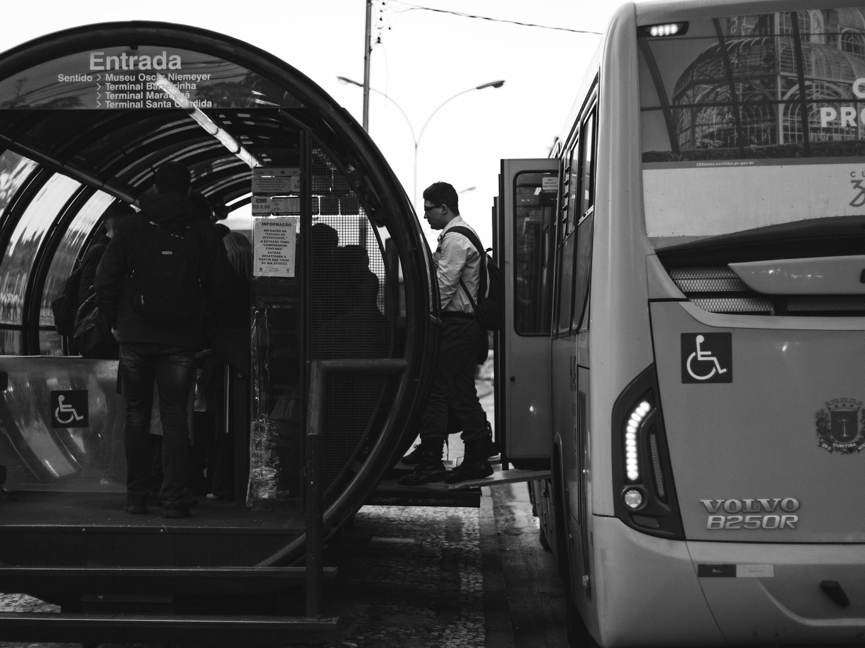 Passengers boarding a bus for Brisbane transfer planning.