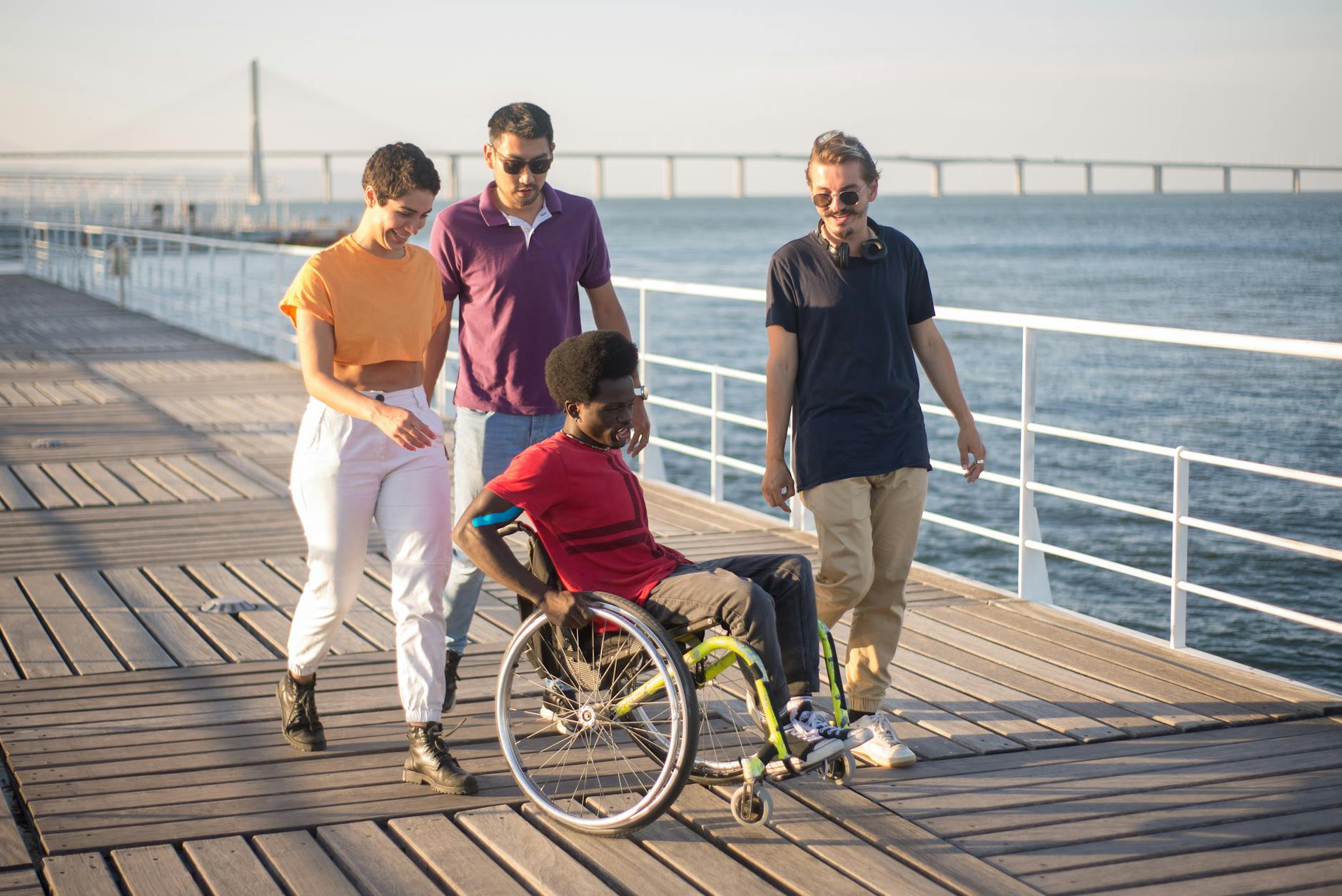 Wheelchair user on a boardwalk for riverfront access planning.