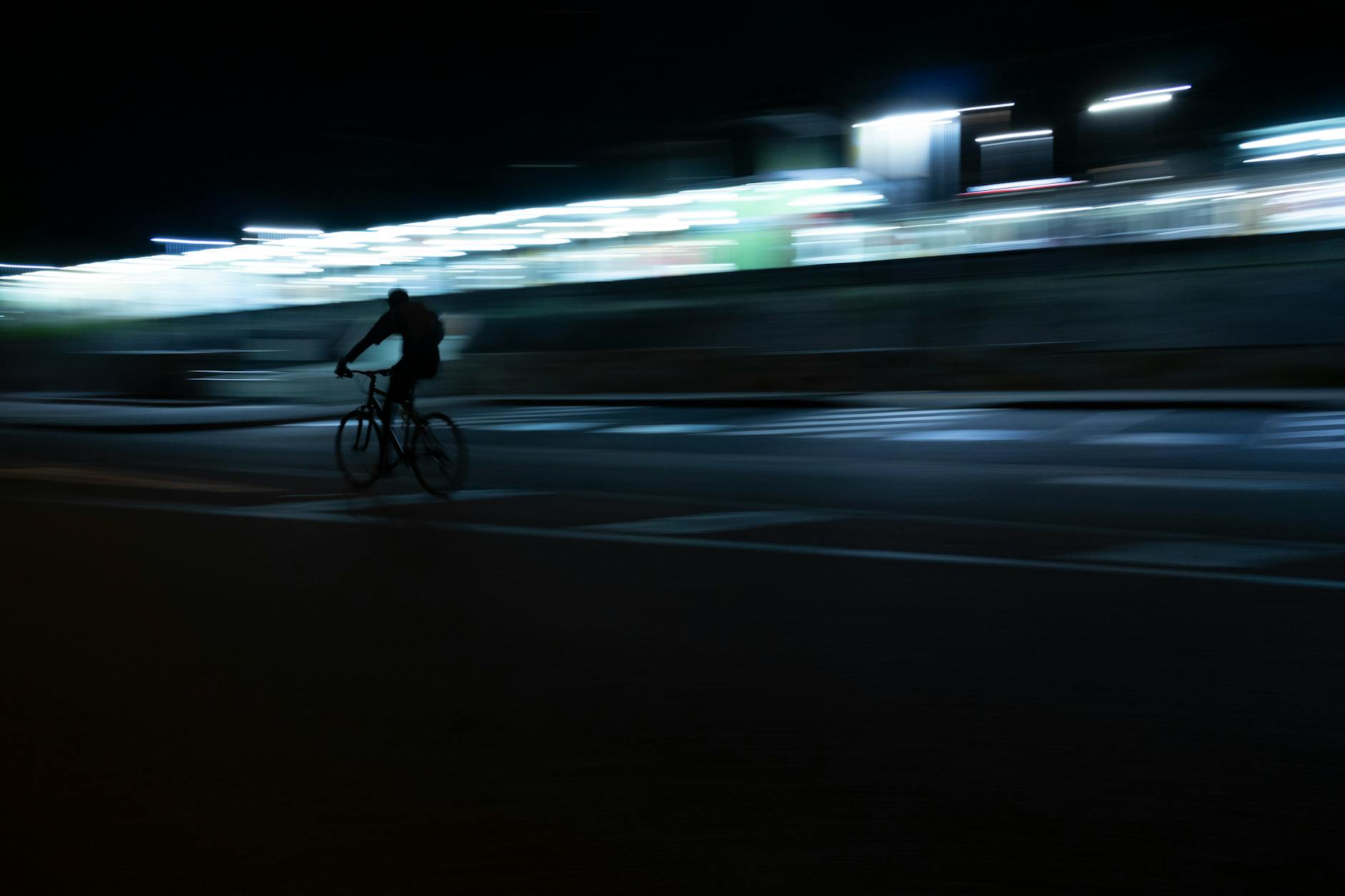Night cyclist in Brisbane for woman traveler arrival and evening planning.