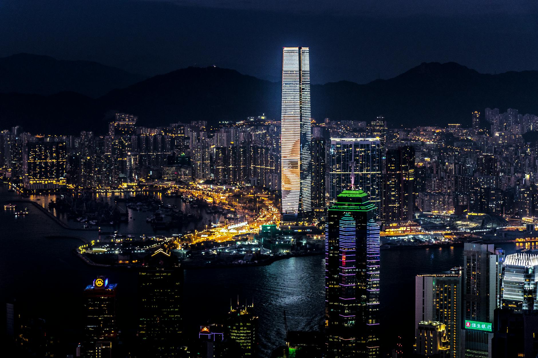 Central Hong Kong night skyline and consultant trip planning context.