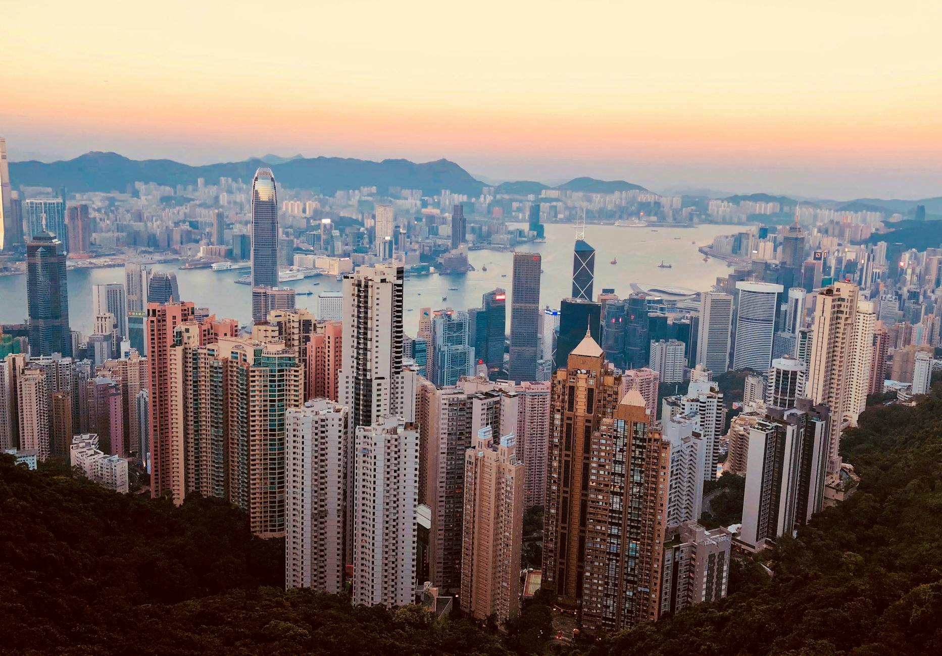 Hong Kong harbor skyline and creator lodging-workflow planning context.