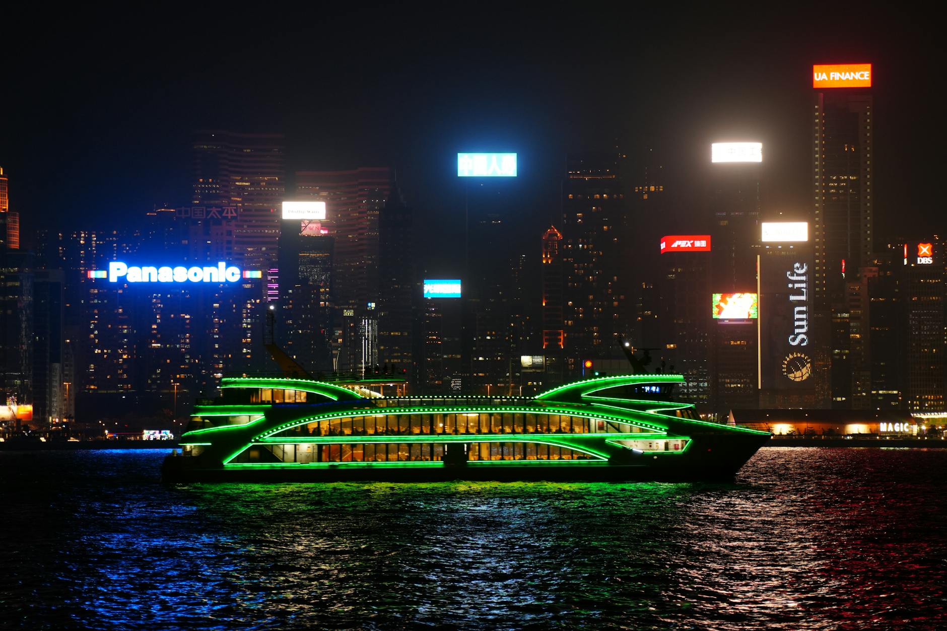 Hong Kong harbor night skyline and cruise port-call planning context.