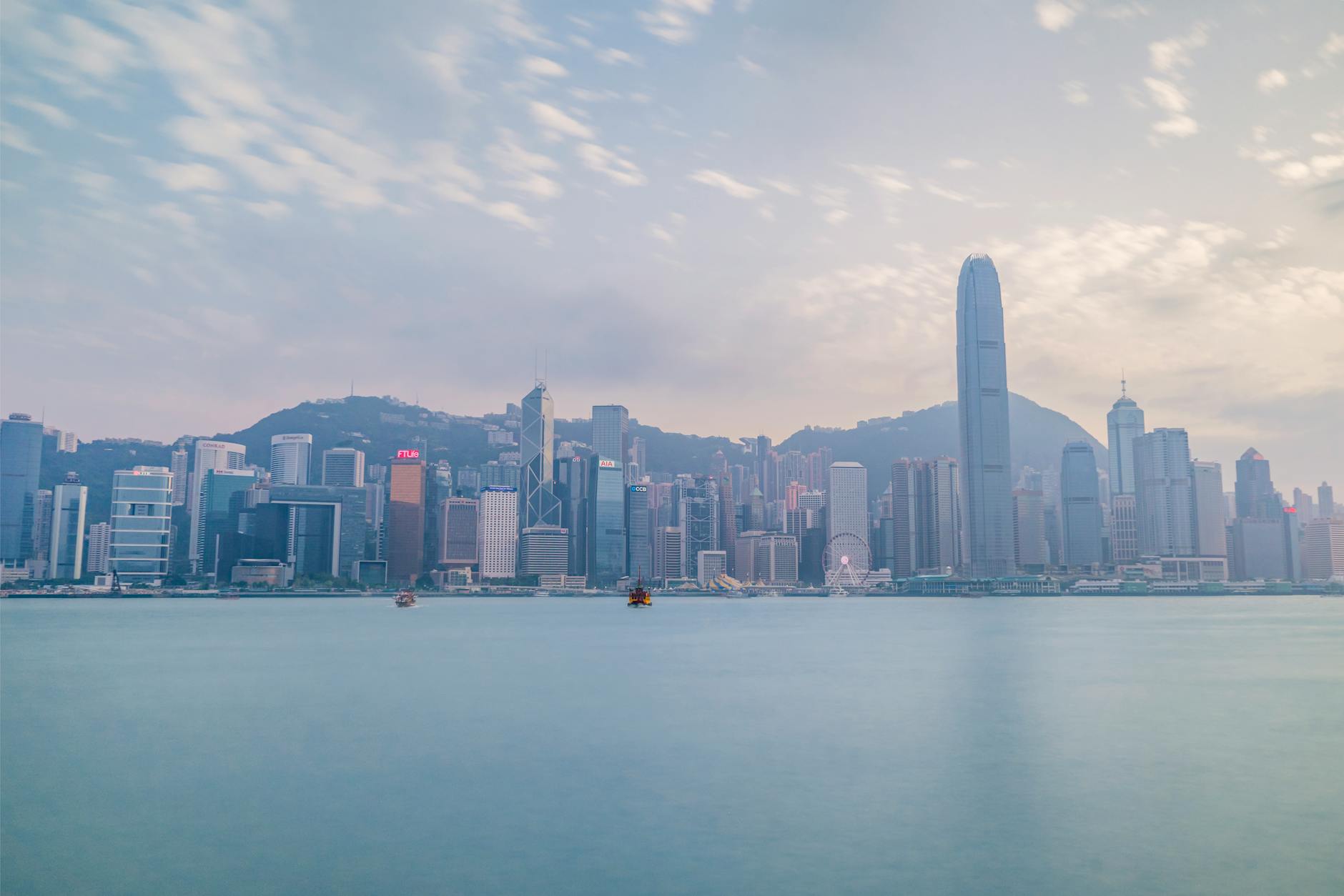 Hong Kong harbor skyline and investor movement planning context.