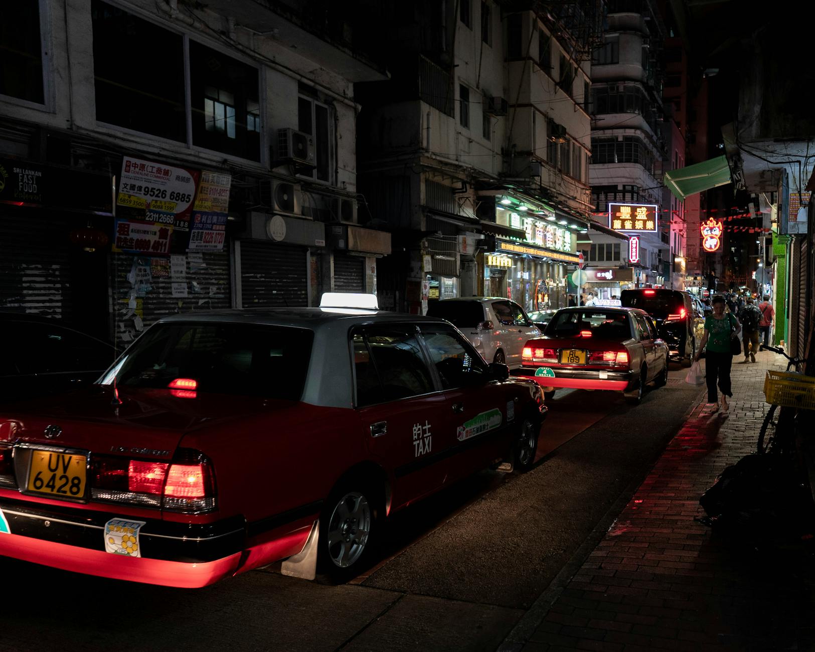 Central Hong Kong taxi at night and nightlife return-route planning context.