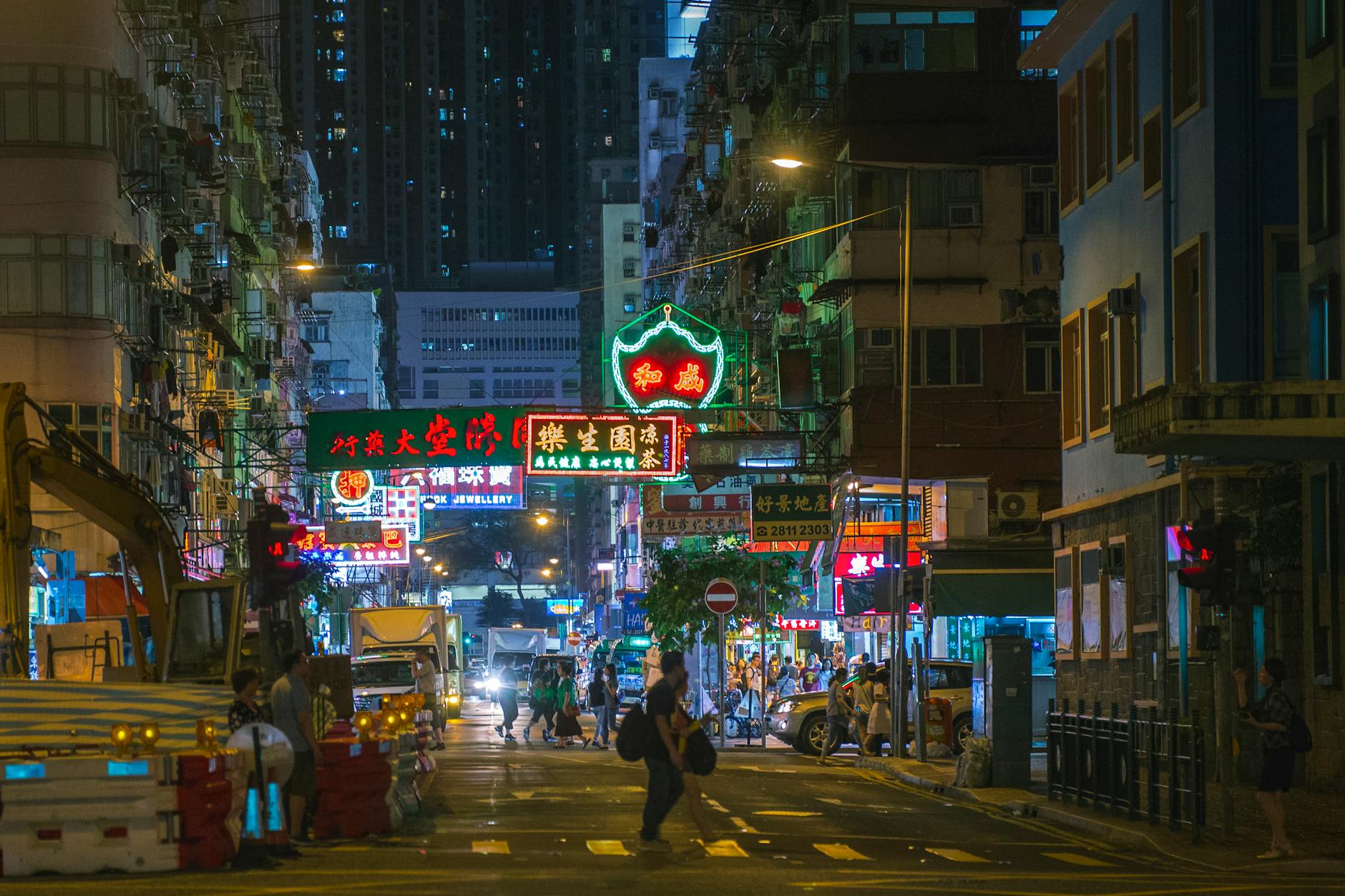 Central Hong Kong night street and volunteer trip planning context.