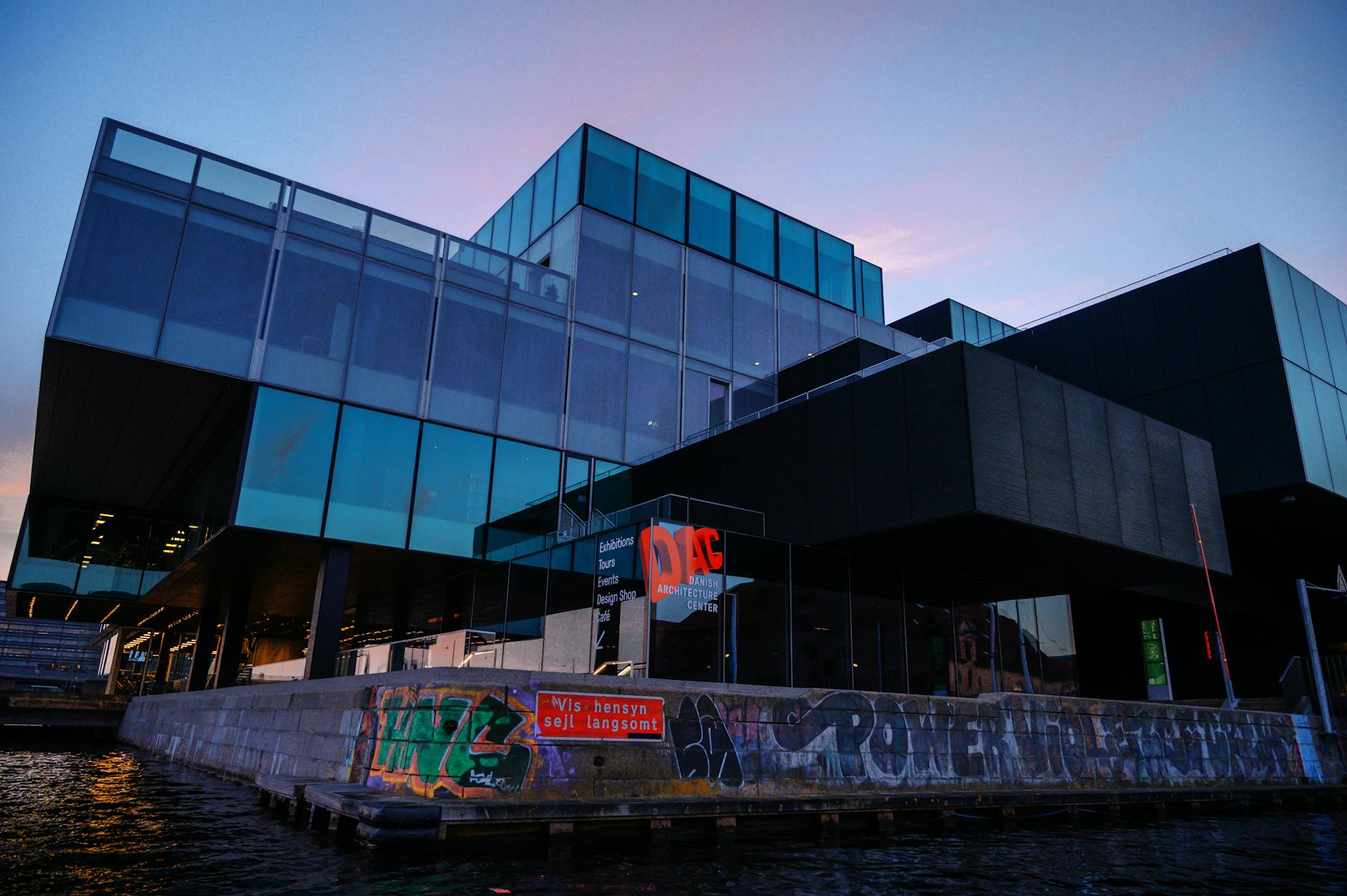 Modern Copenhagen waterfront building for conference lodging planning.