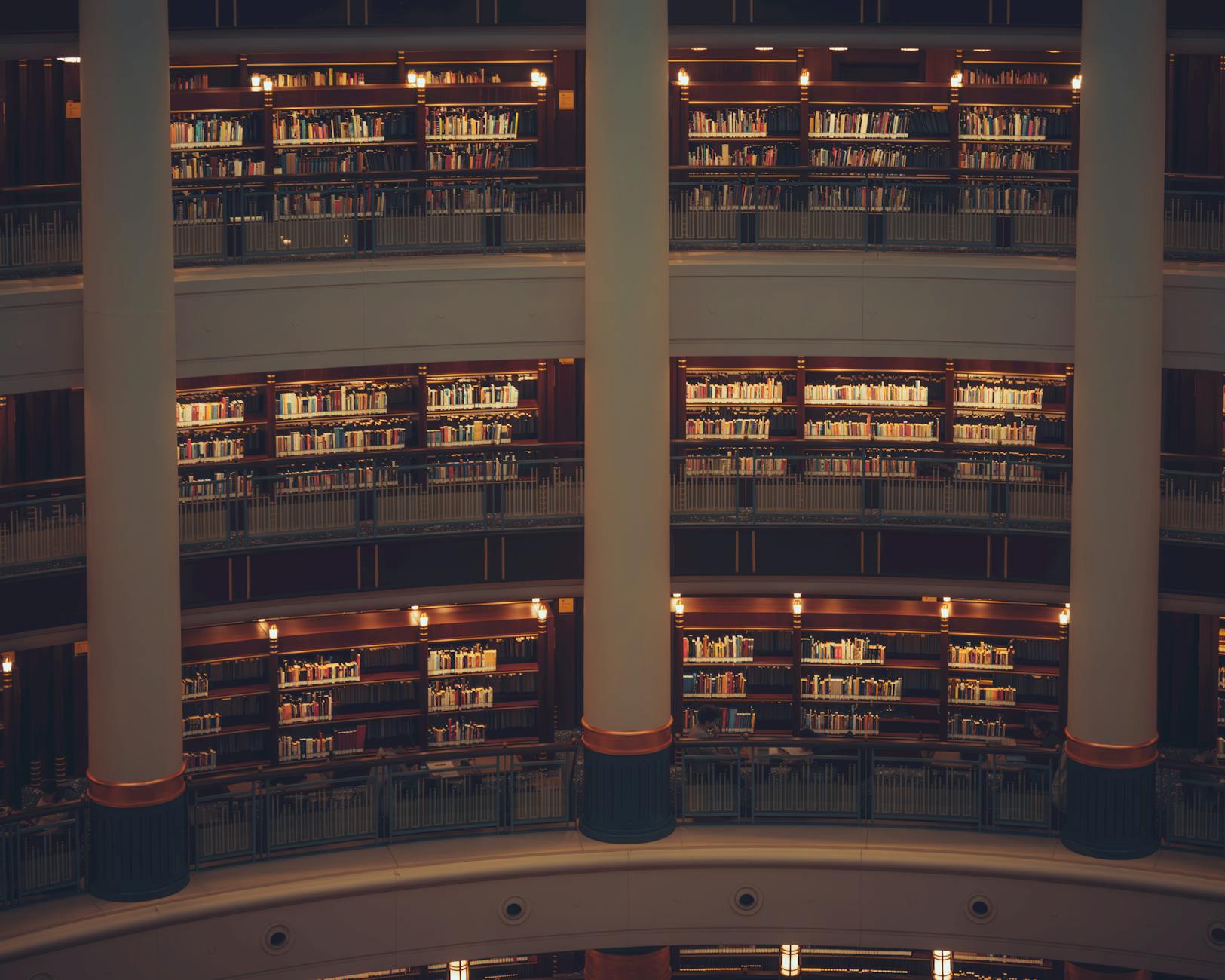 Quiet library shelves for academic conference work planning.