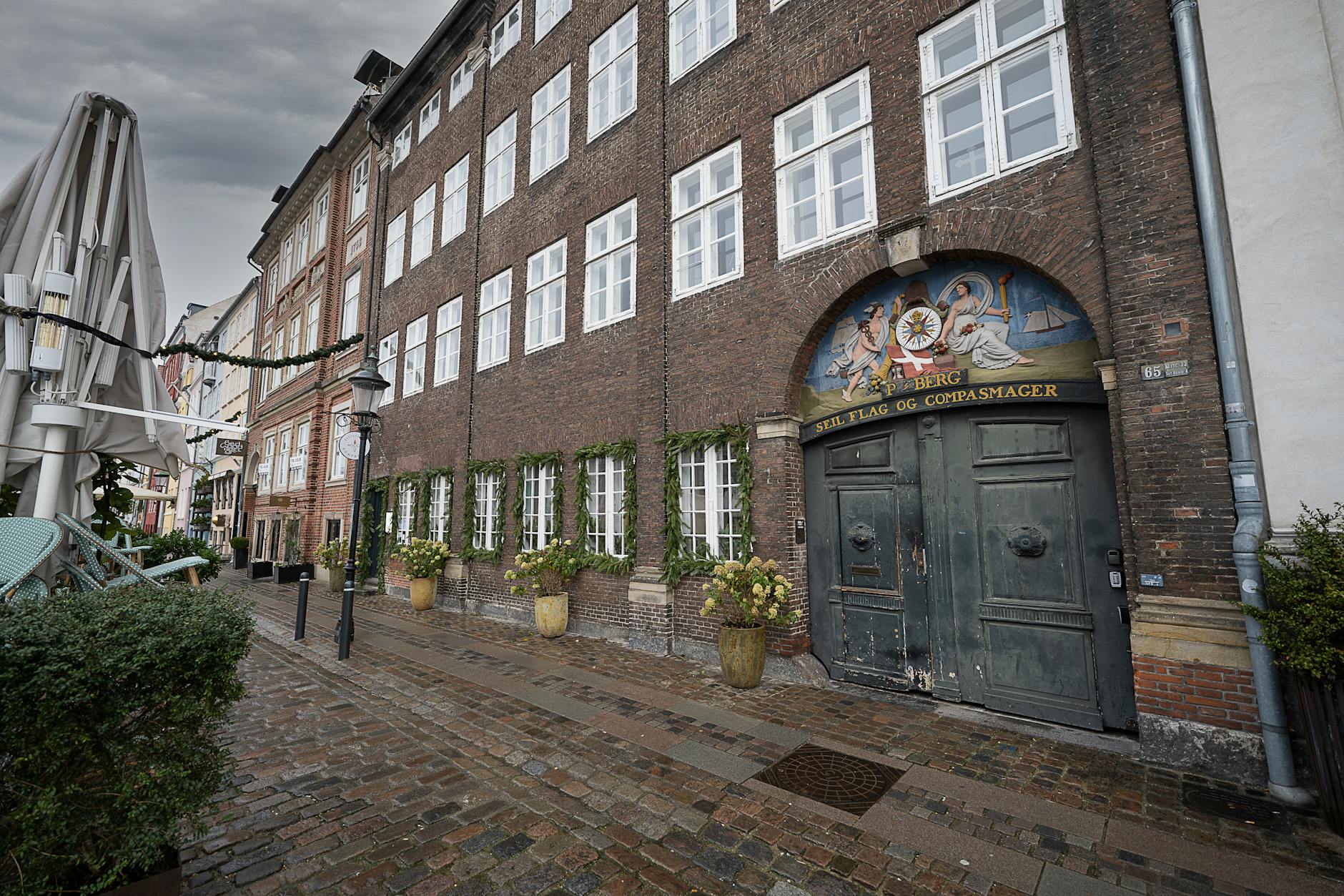 Copenhagen cobblestone street for budget lodging tradeoff planning.