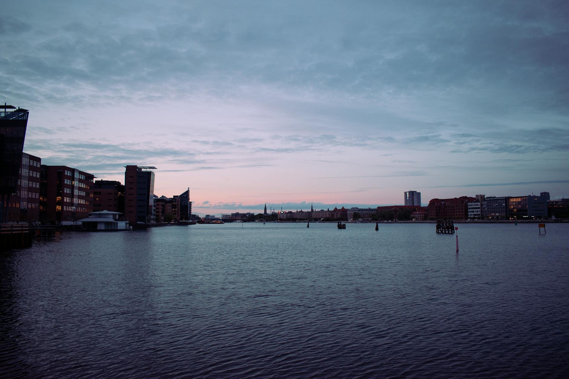 Copenhagen waterfront skyline at dusk for conference reception planning.
