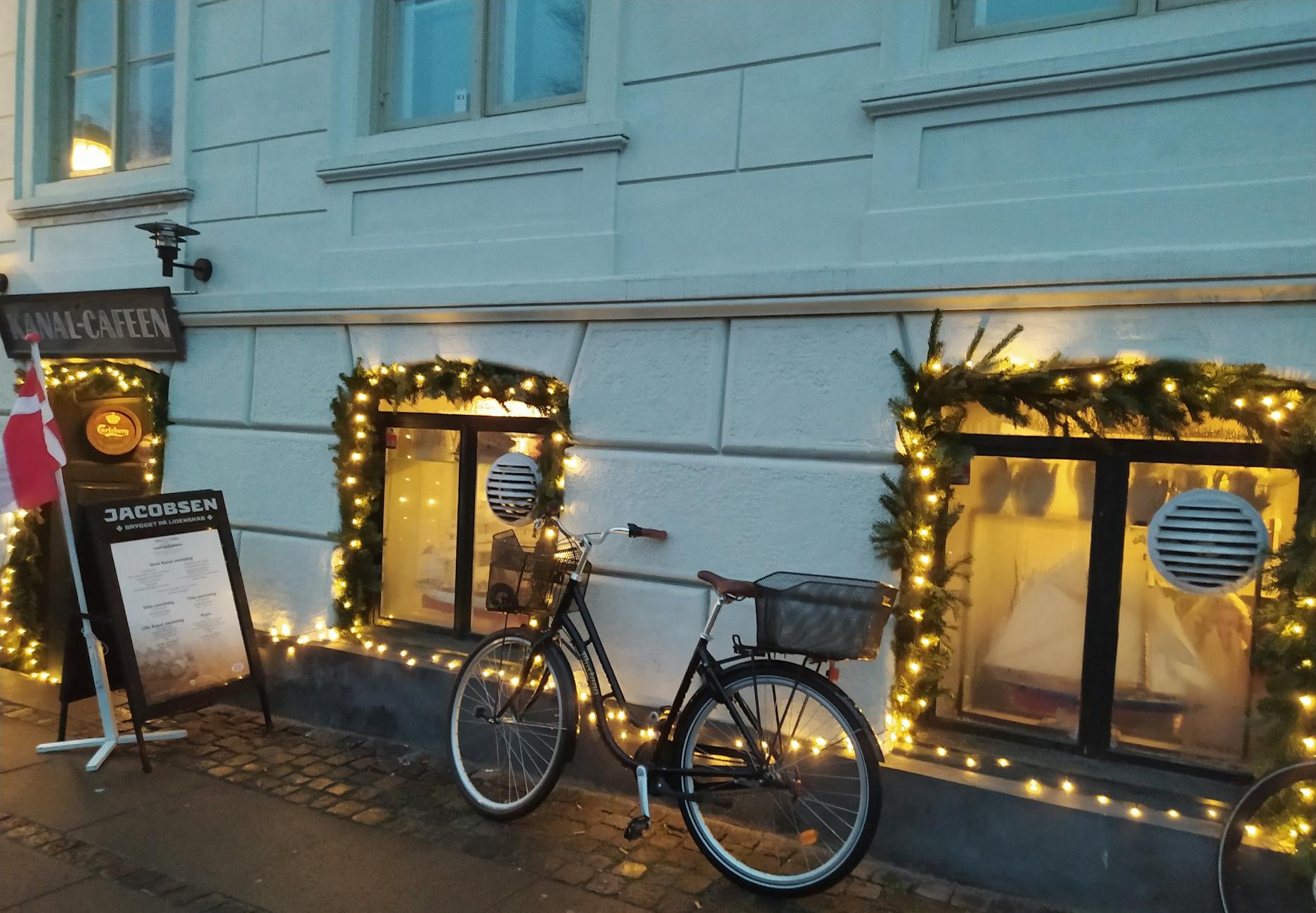Copenhagen cafe with bicycle and lights for content creator planning.