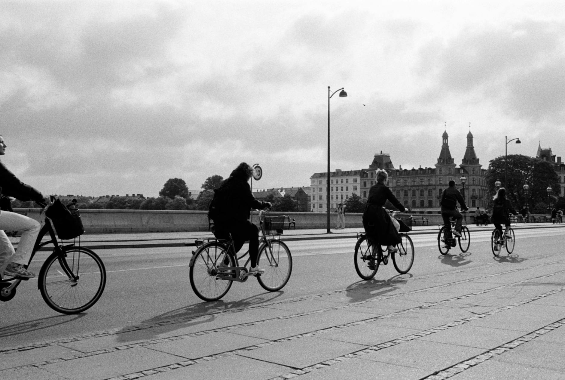 Cyclists on a Copenhagen bridge for content workflow planning.