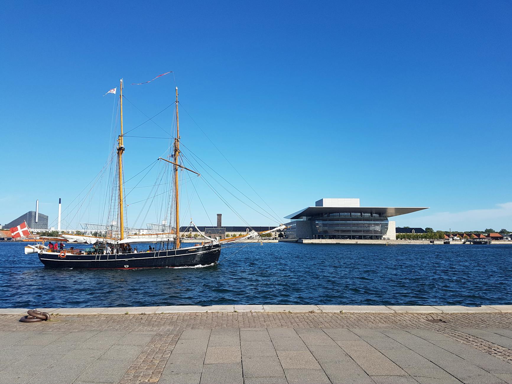 Sailing ship by Copenhagen Opera House for cruise report planning.