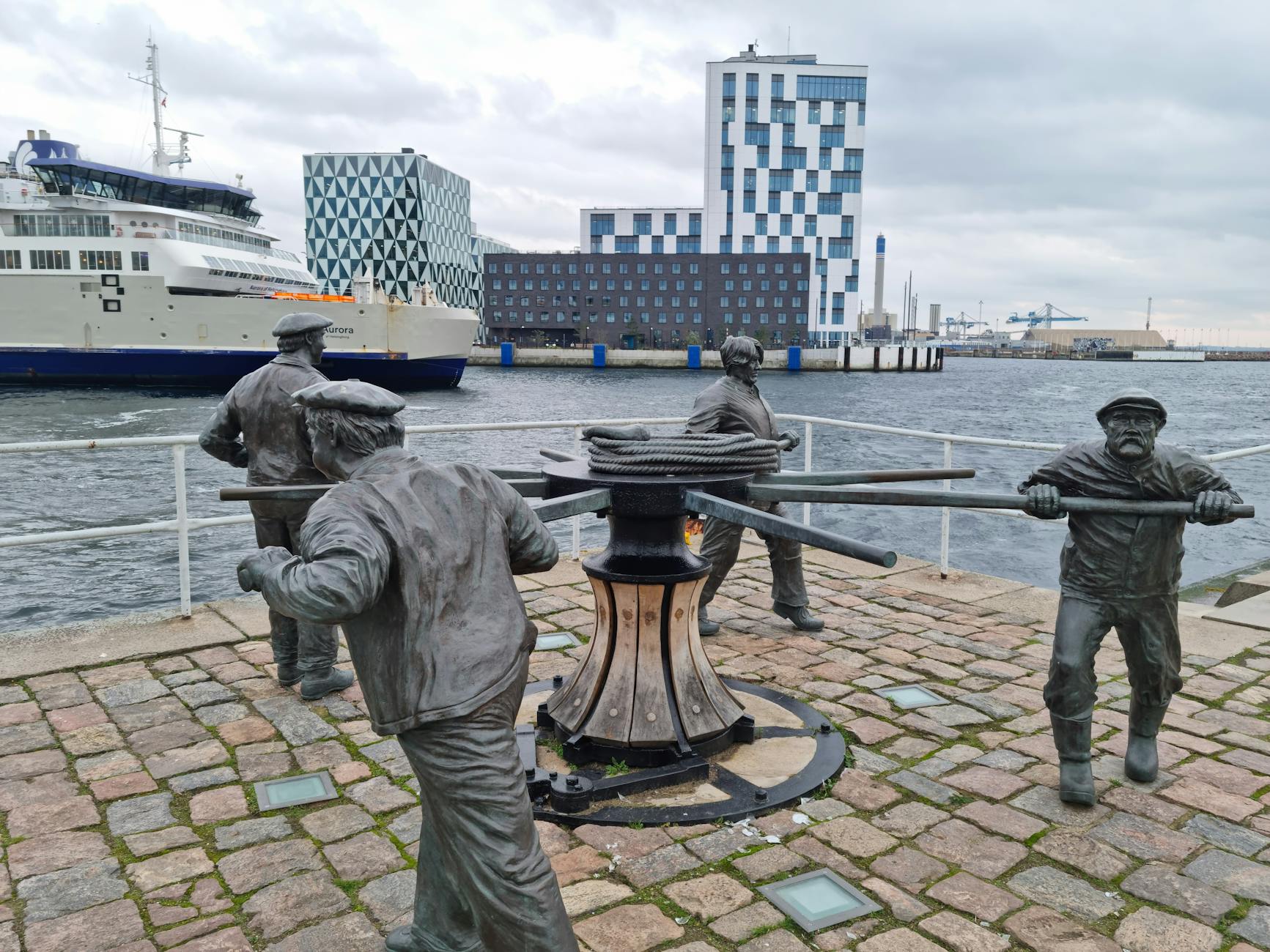 Copenhagen waterfront with ferry and modern buildings for compact cruise routing.