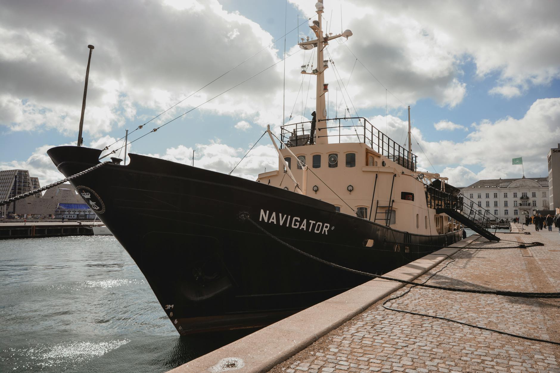 Ship moored in a Danish harbor for Copenhagen cruise port planning.