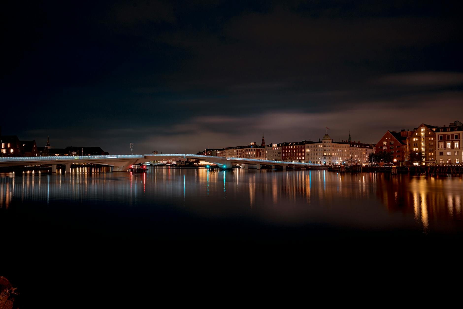 Copenhagen bridge lights at night for first-time travel report planning.