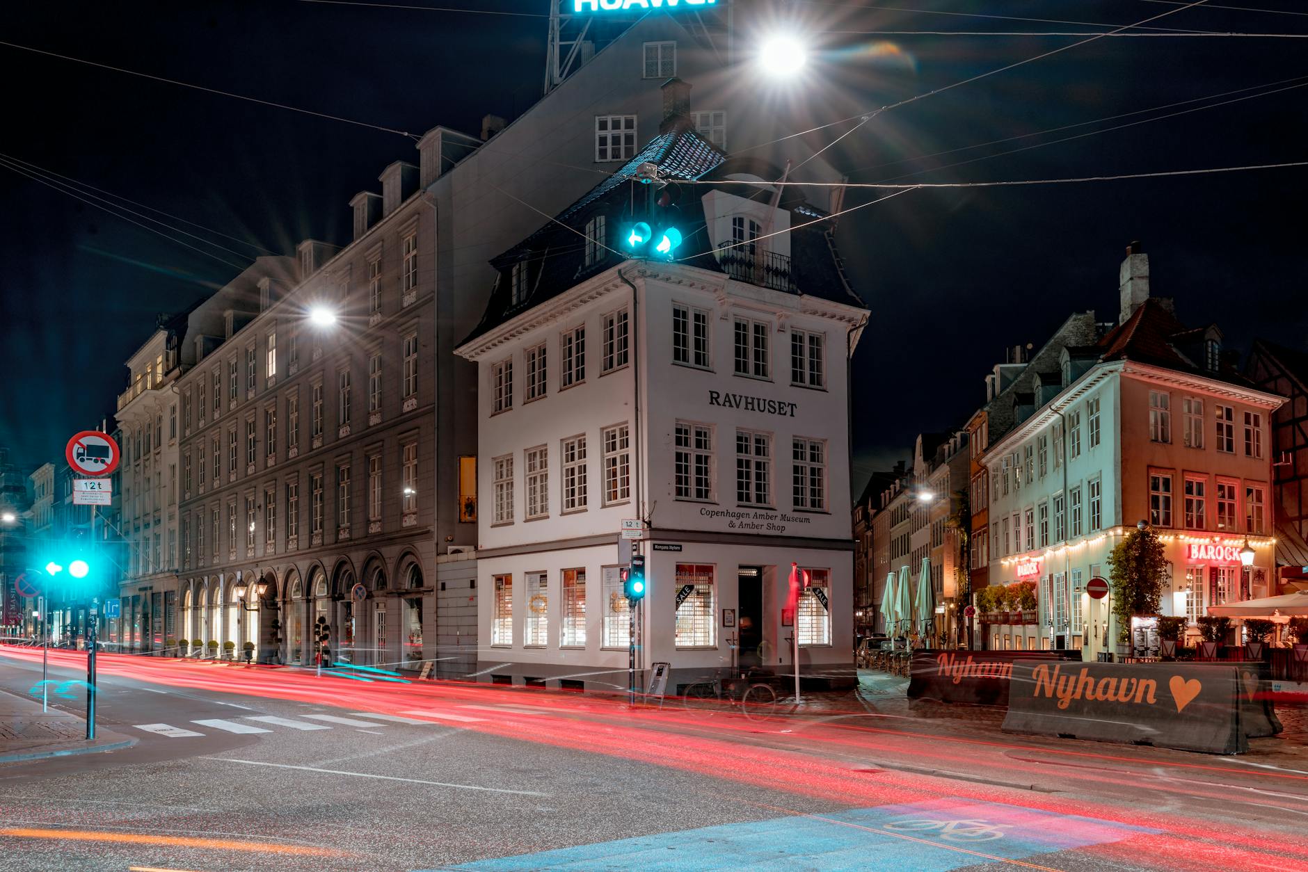Illuminated Nyhavn in Copenhagen for journalist evening planning.