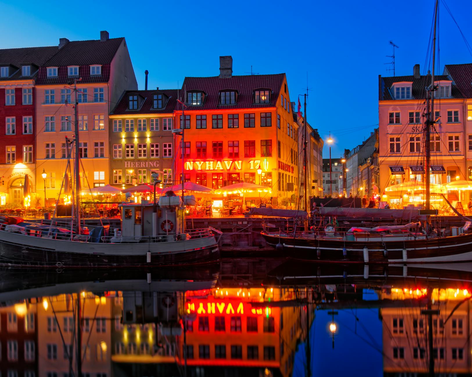 Nyhavn waterfront at dusk for Copenhagen luxury travel report planning.