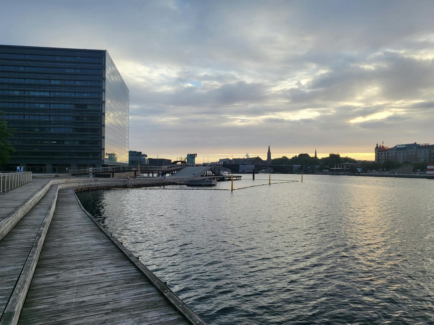 Modern Copenhagen waterfront boardwalk for luxury wellness planning.