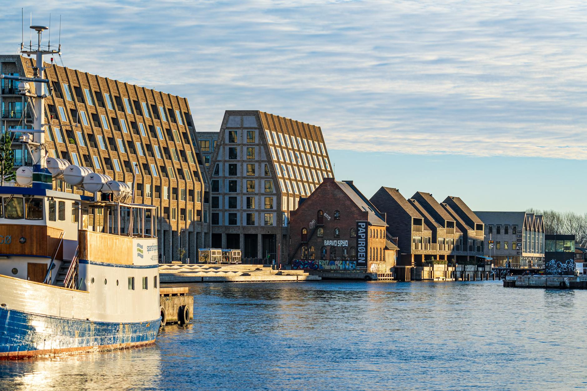 Modern Copenhagen waterfront buildings for hotel access planning.