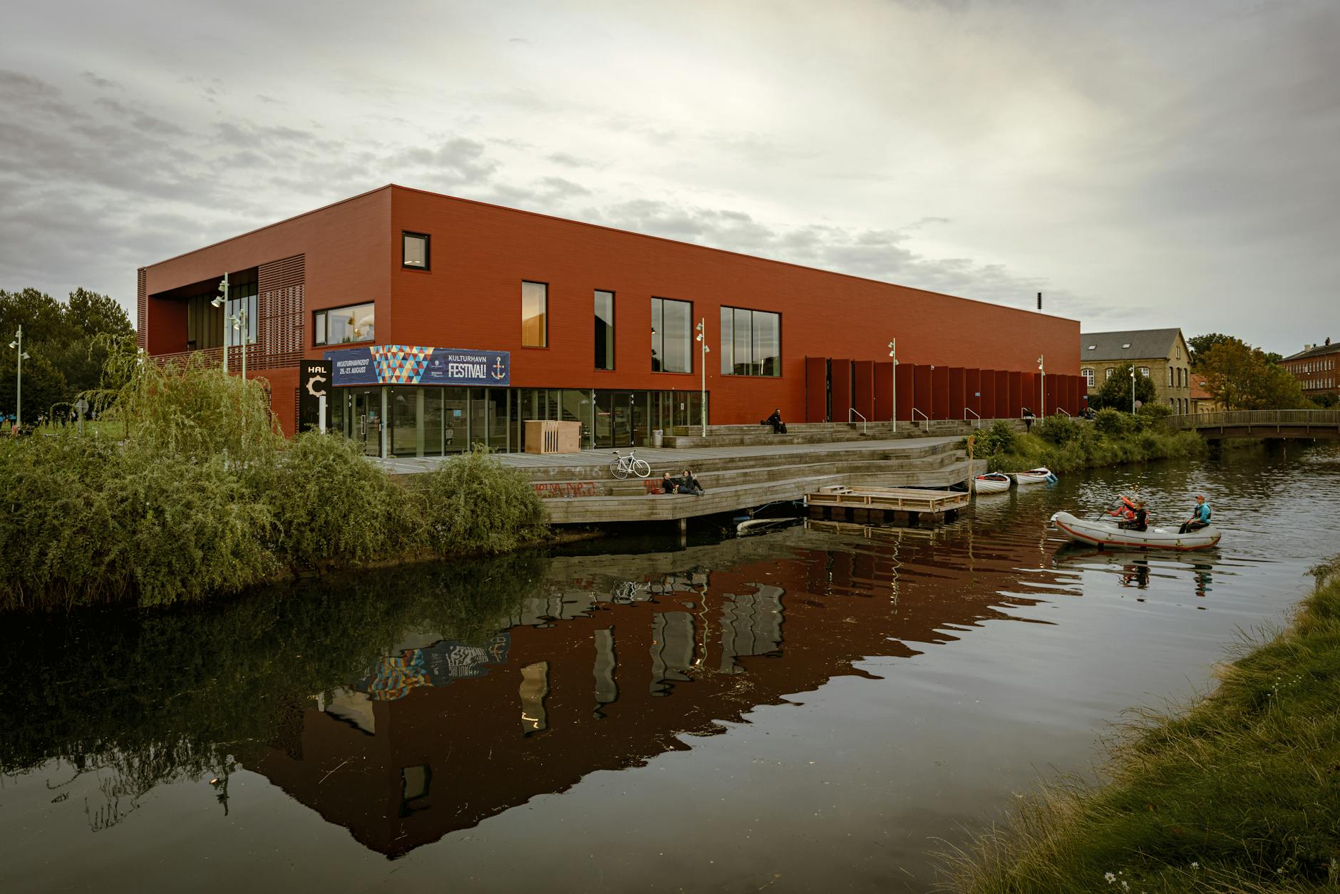 Contemporary Copenhagen canal building for NGO meeting location planning.