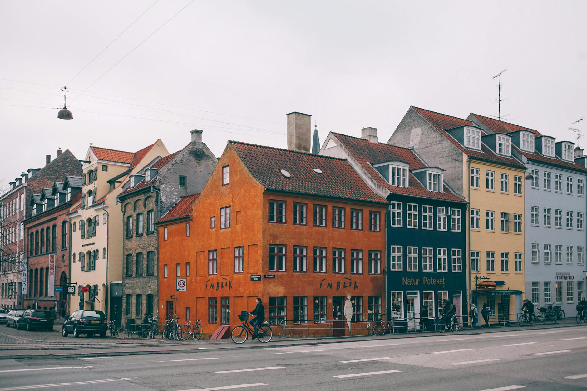 Colorful Copenhagen street for solo meal and cafe planning.