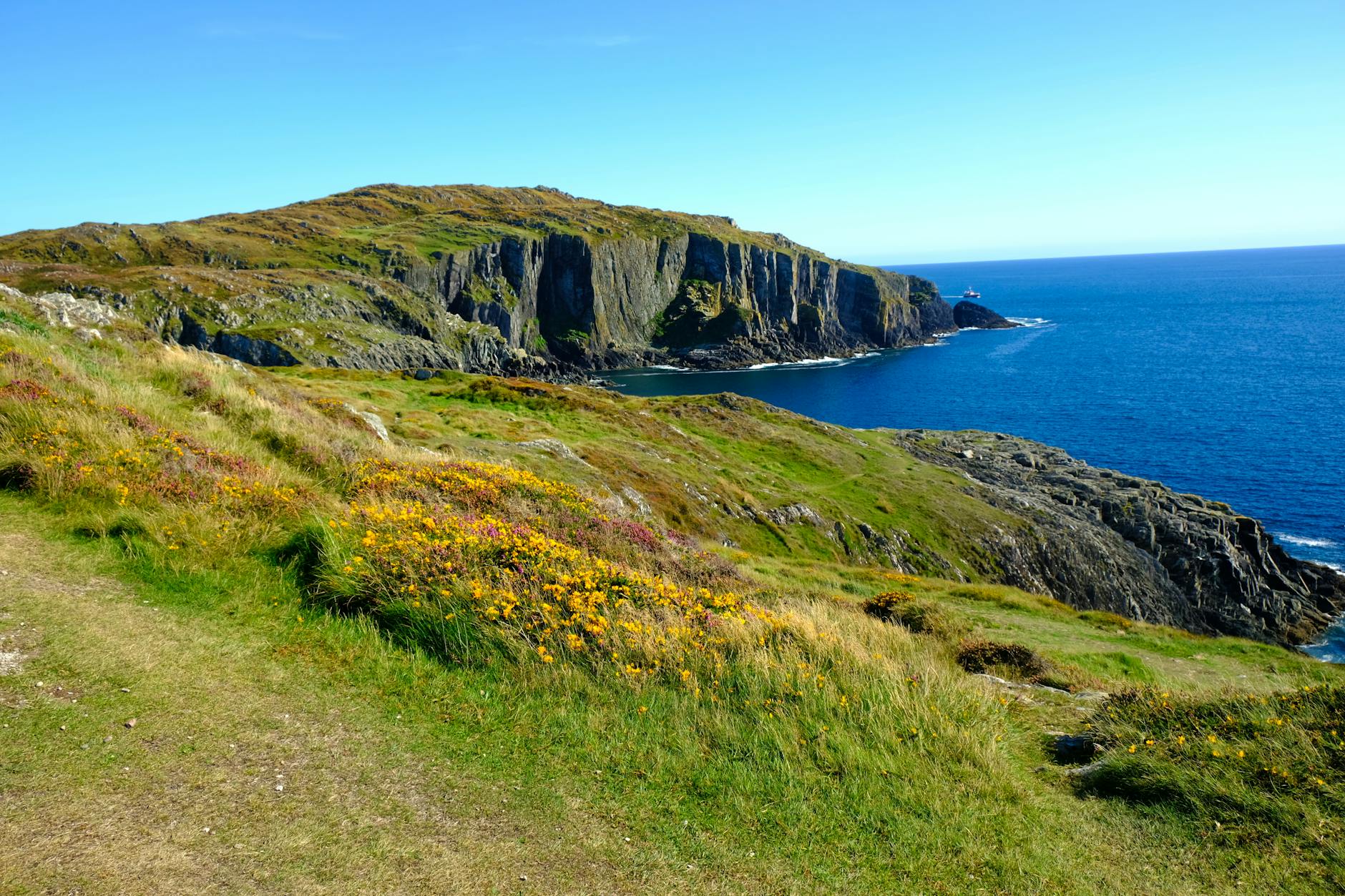 Vibrant coastal landscape of cliffs and ocean in Baltimore, Ireland.