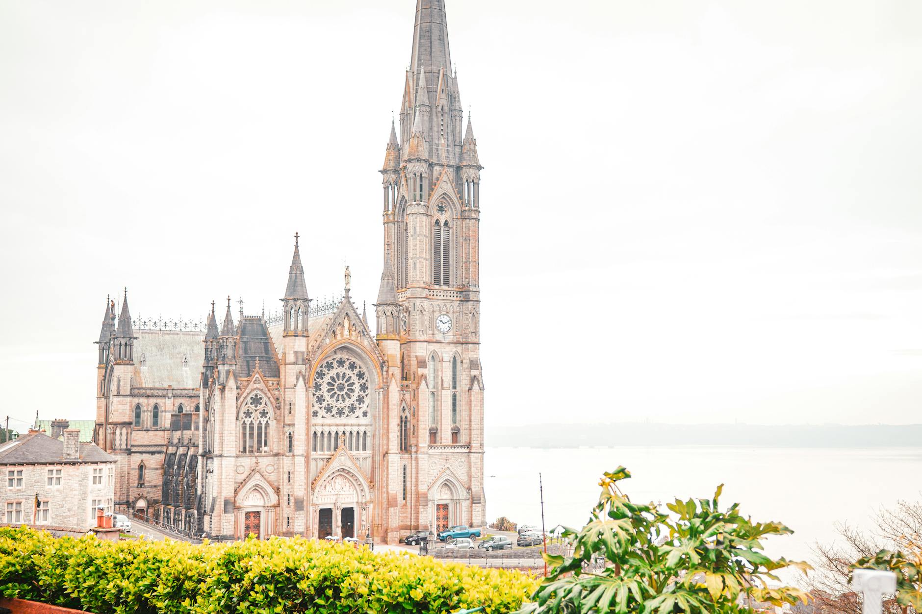 A vibrant shot of St. Colman's Cathedral with water view in Cobh, Ireland.