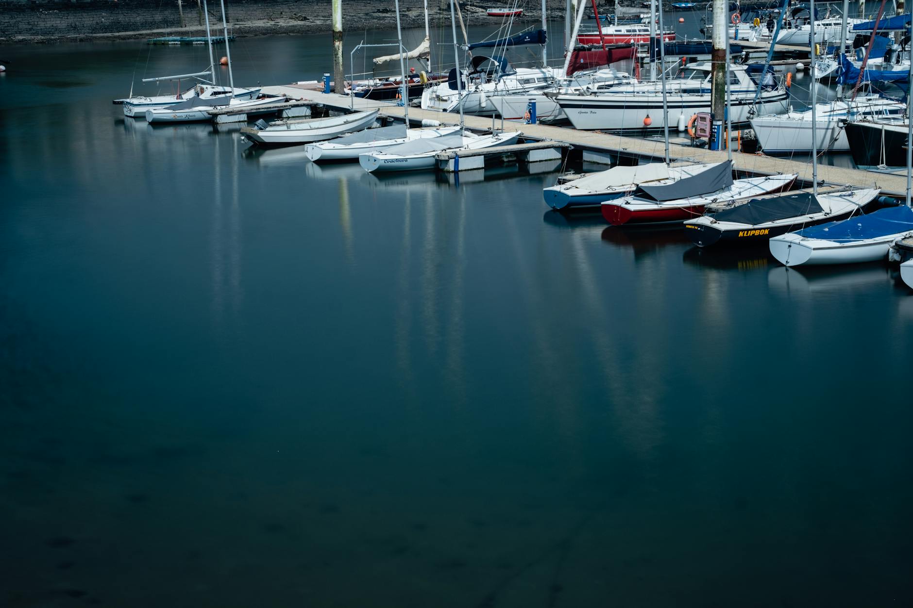 Peaceful marina with sailboats in Cork, Ireland. Perfect for nautical travel and maritime scenes.