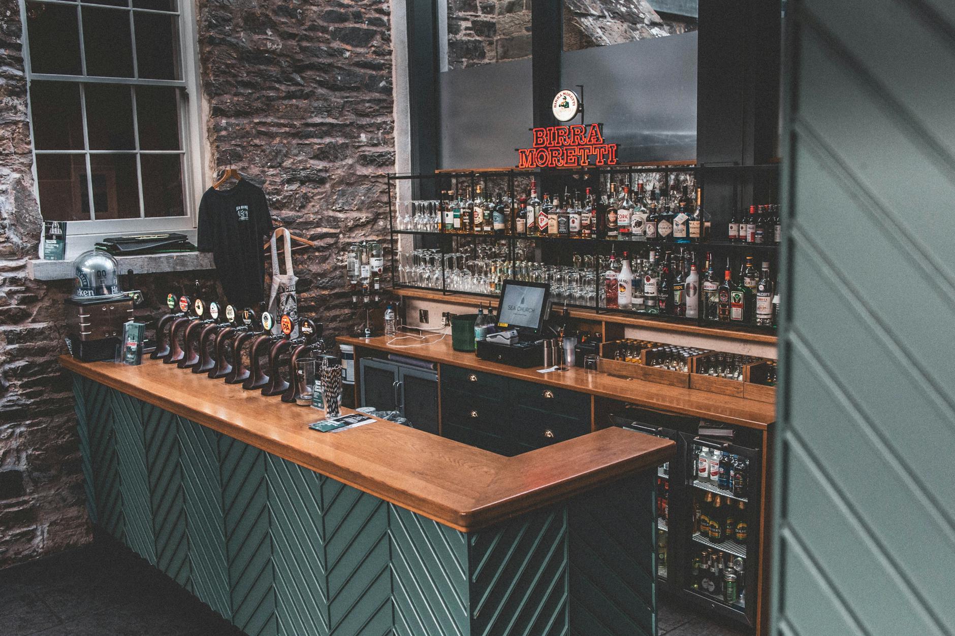 Cozy Irish pub interior in Ballycotton, featuring vintage decor and a fully stocked bar.