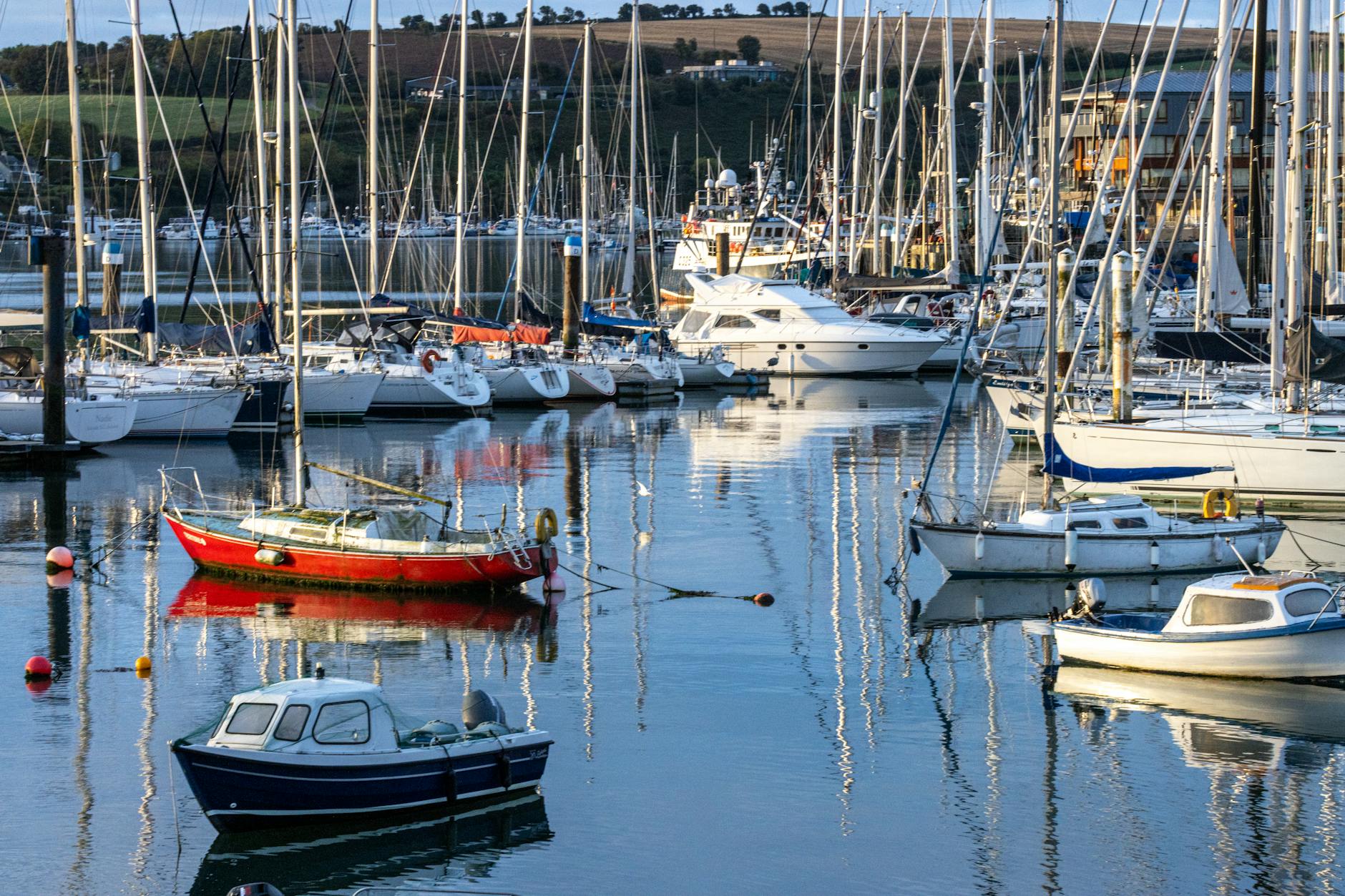 Boats and yachts docked at Kinsale Marina in County Cork, Ireland during summer.