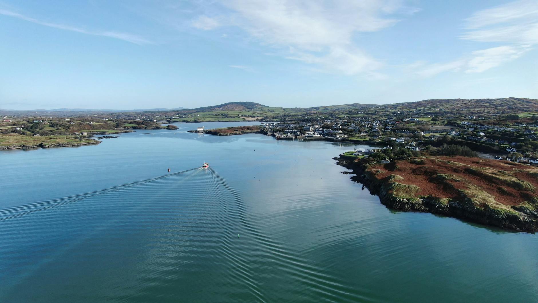 A breathtaking aerial view of Baltimore Harbor in County Cork, showcasing serene waters and picturesque landscapes.
