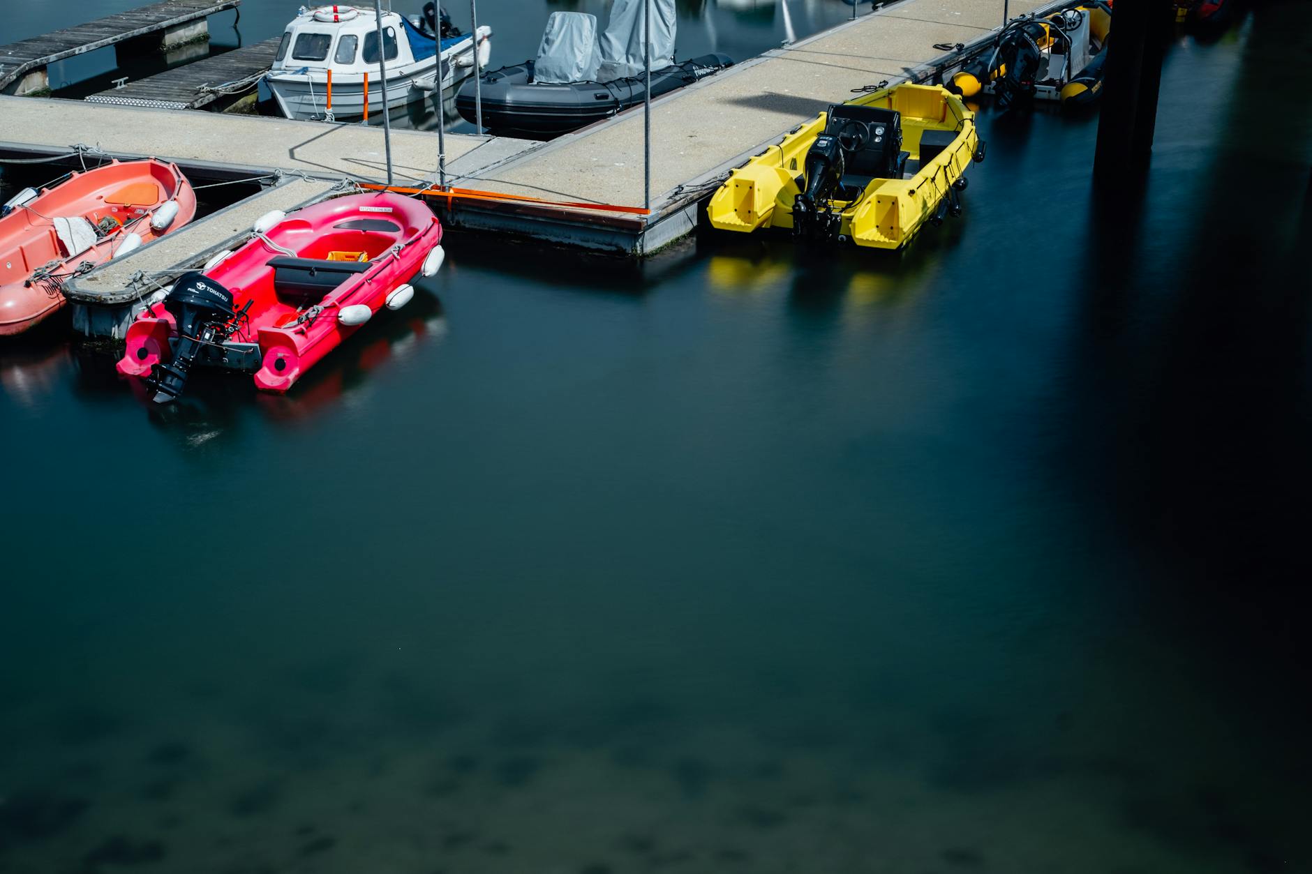 Vibrant boats docked at a serene marina in Cork, Ireland. Perfect for travel and maritime scenes.