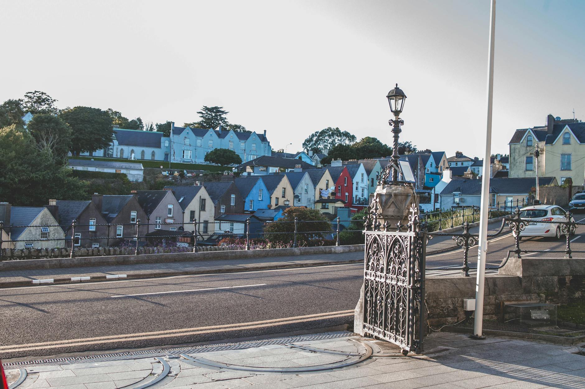 Charming street view of vibrant houses in Cobh, Ireland, showcasing traditional architecture.