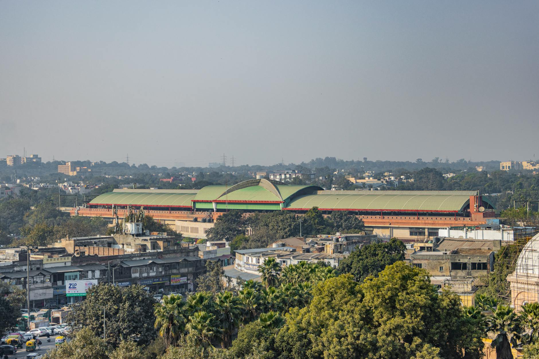 Panoramic view of Pragati Maidan and the New Delhi skyline for academic conference planning.