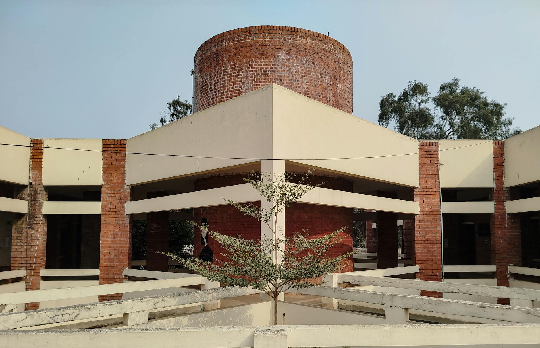 Modern academic building in India for Delhi conference lodging decisions.
