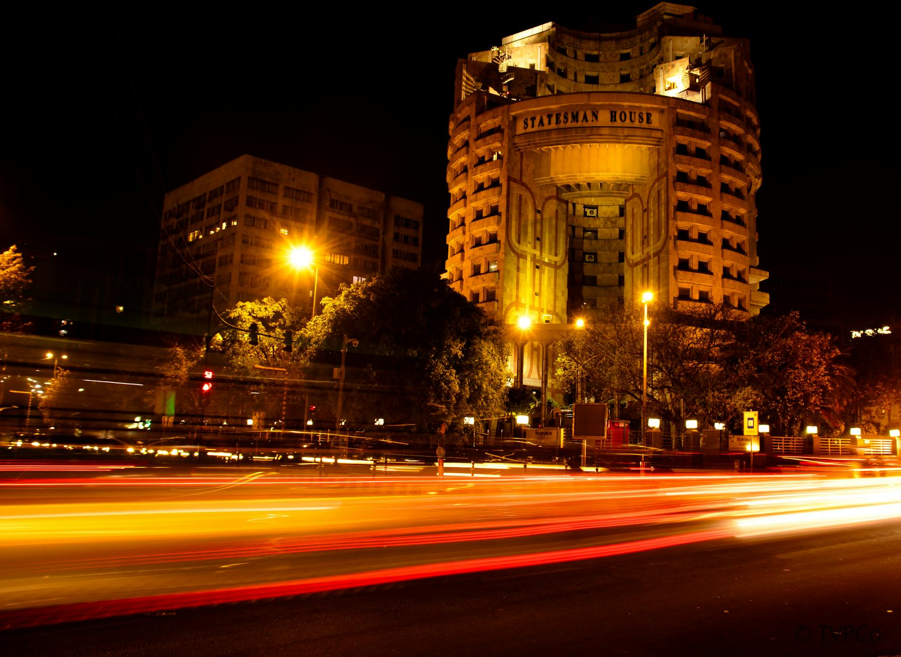 Statesman House at night in Delhi for business arrival planning.