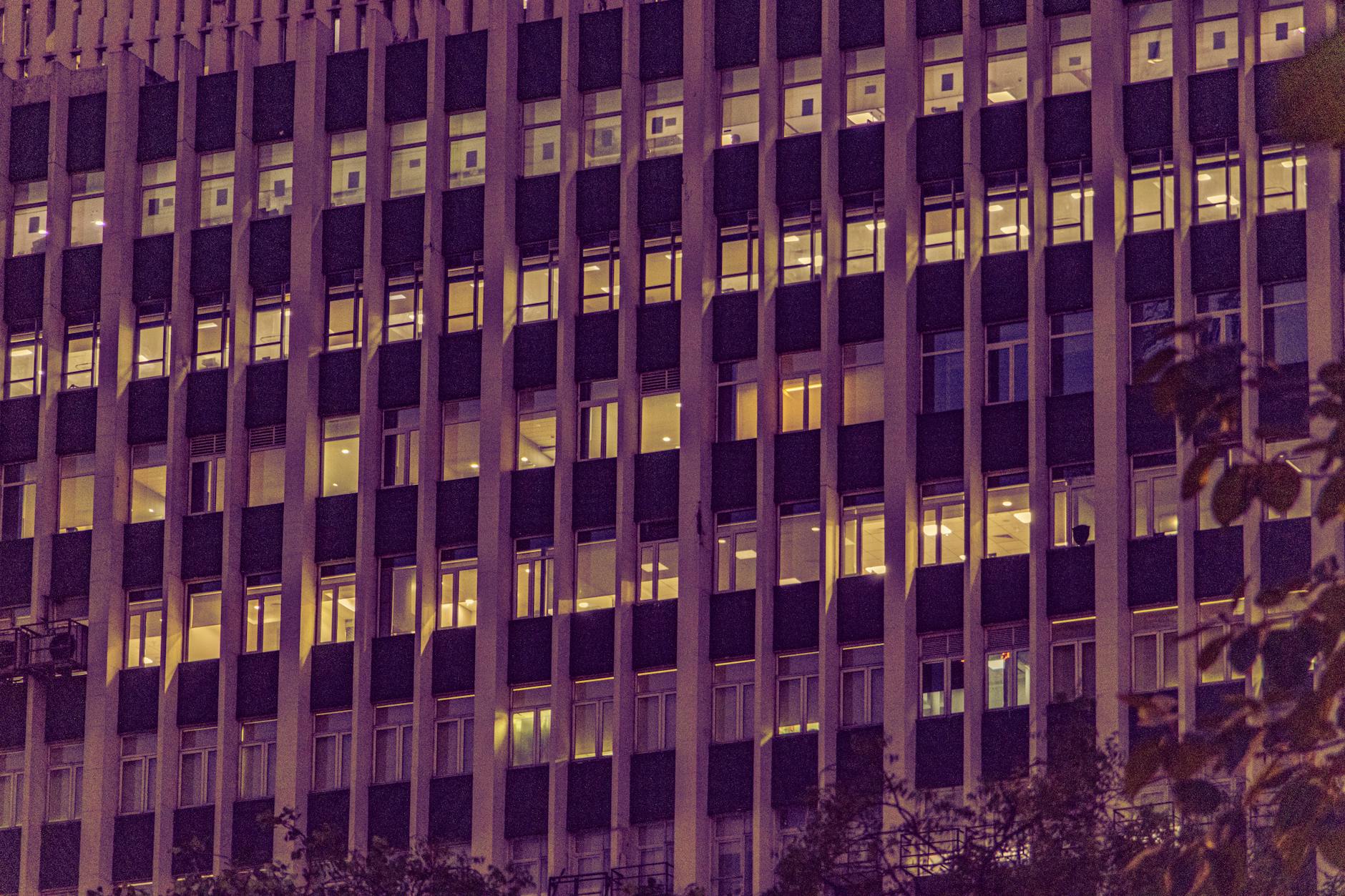 Illuminated New Delhi office building for business access planning.