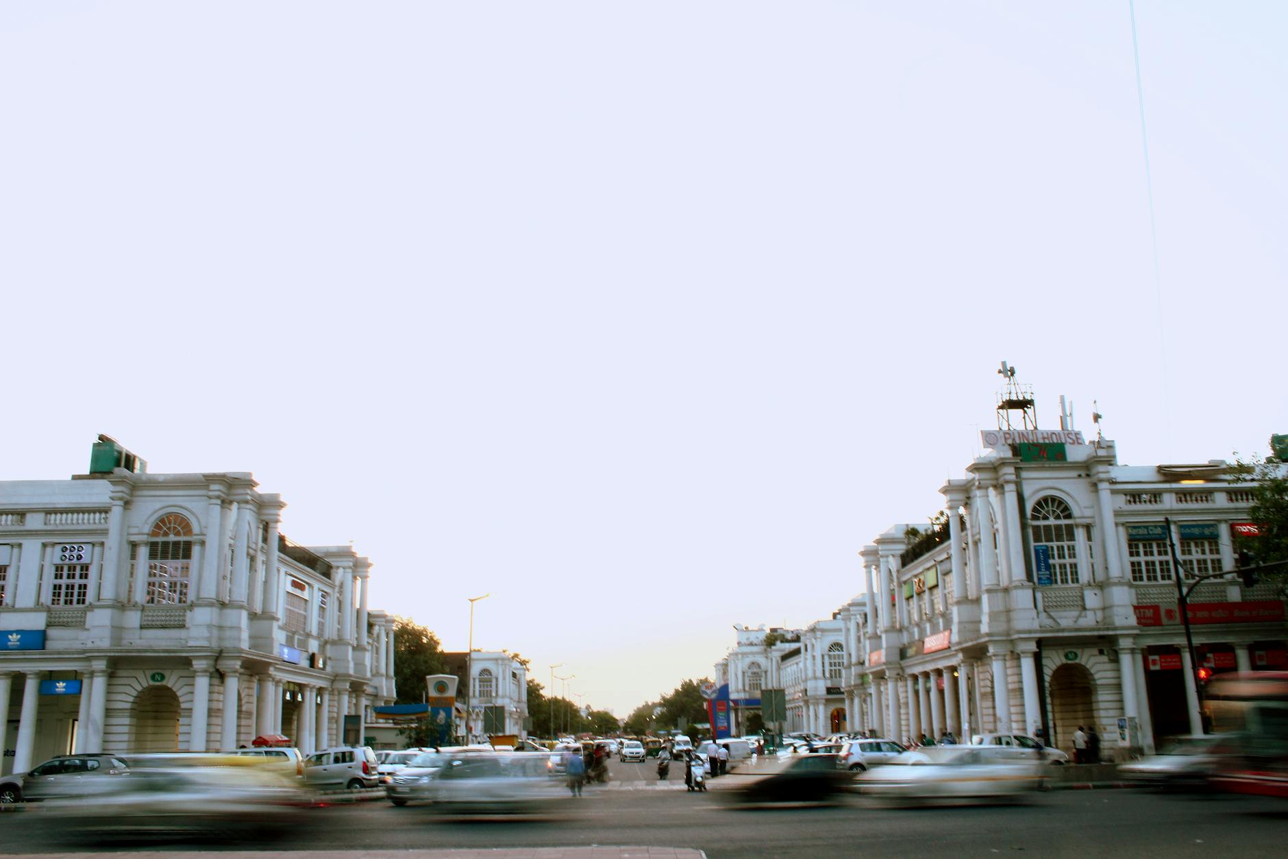 Connaught Place traffic at dusk for Delhi business geography planning.