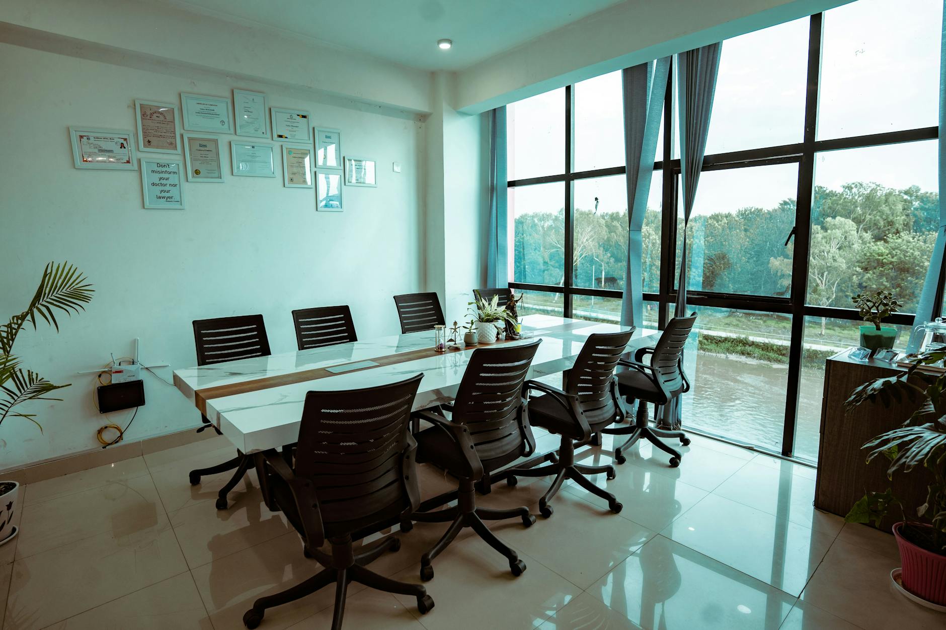 Modern meeting room with greenery view for Delhi conference work planning.