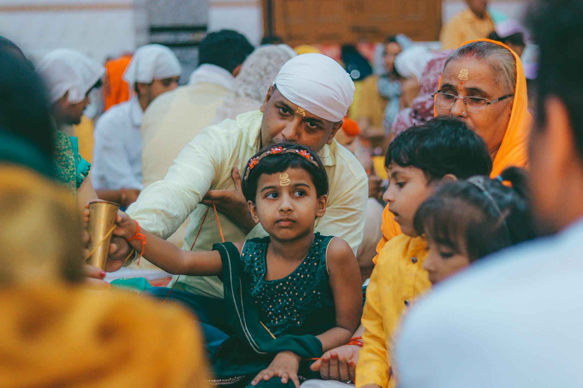 Family gathering during a traditional festival in Delhi for family travel planning.