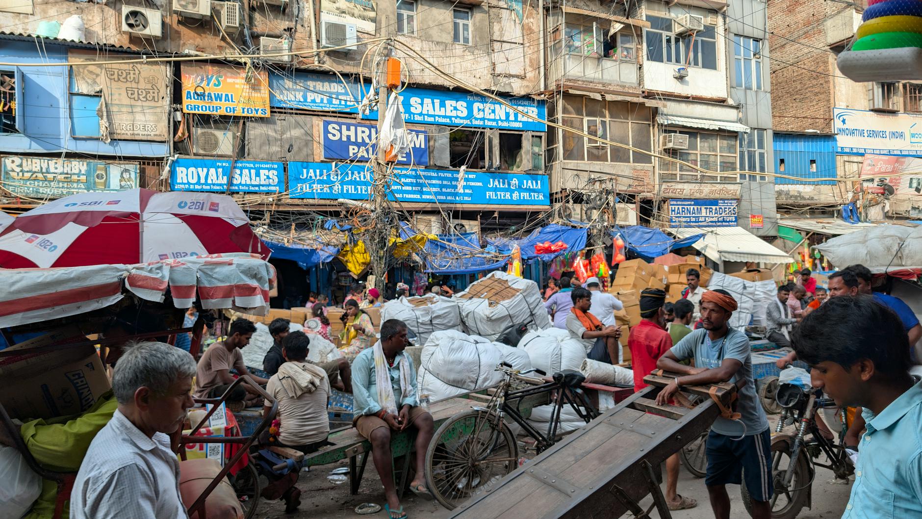 Busy Old Delhi street market for first-time visitor food and shopping planning.