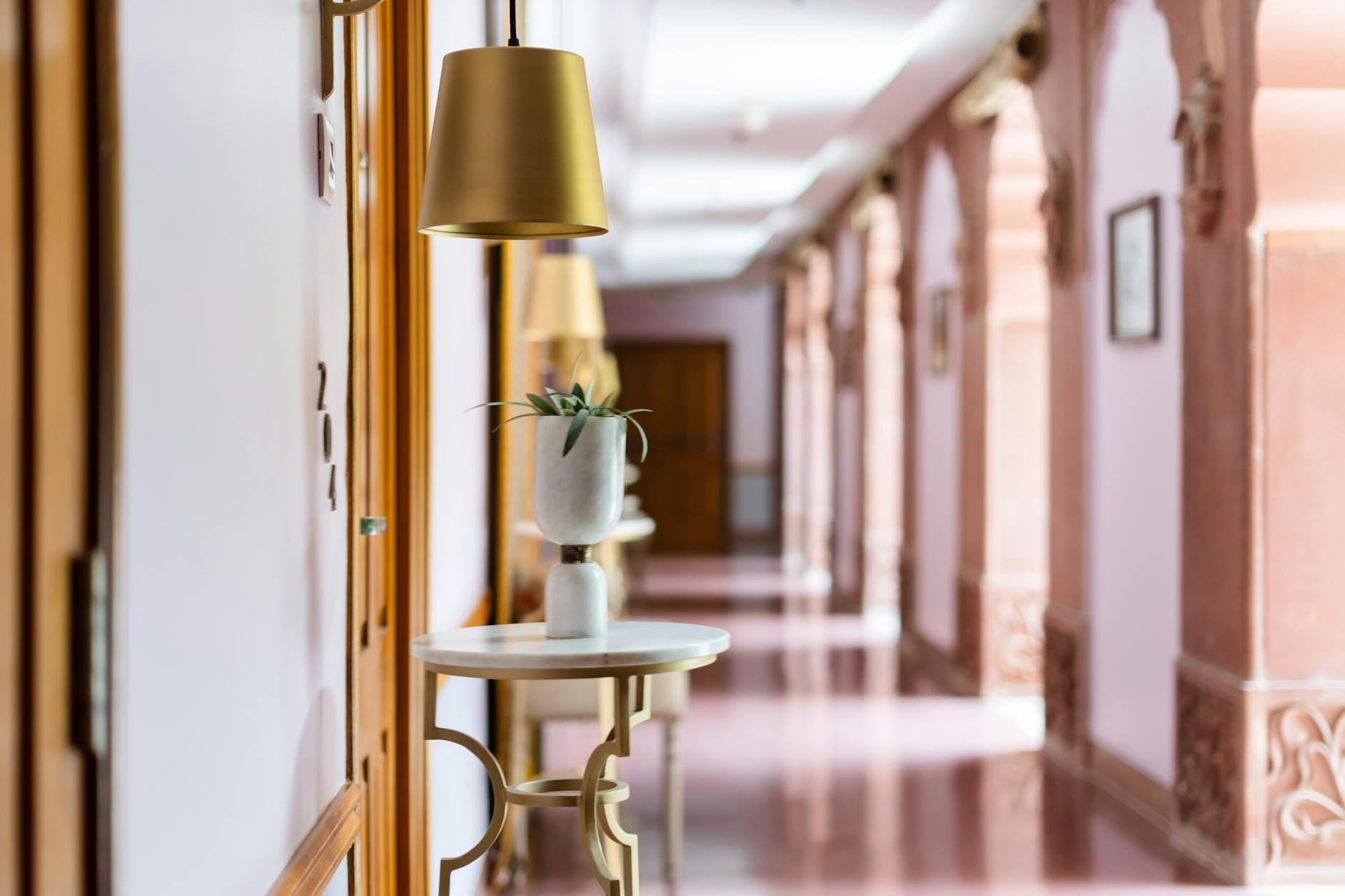 Elegant Indian heritage hotel corridor for Delhi luxury lodging decisions.