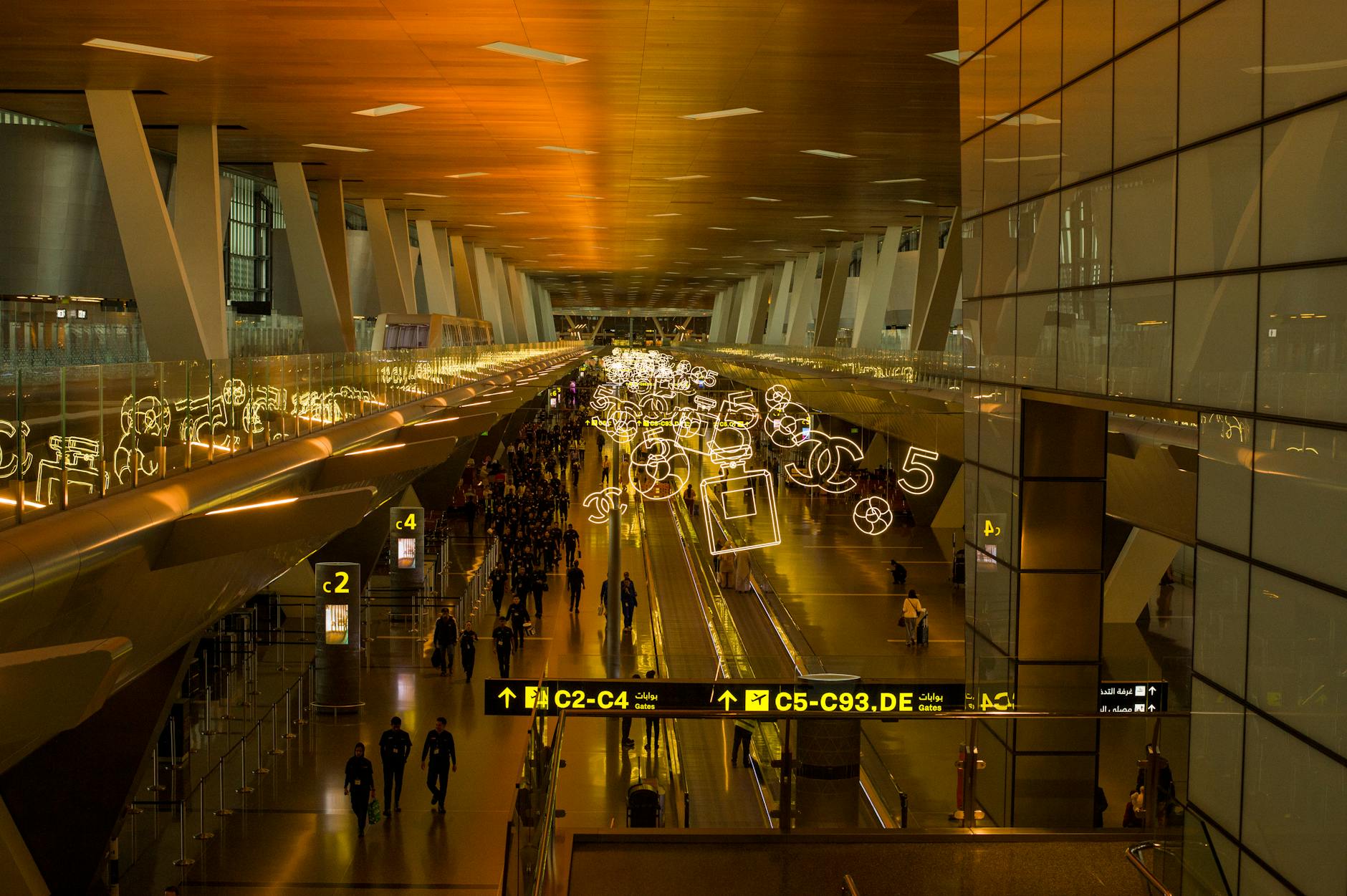 Busy airport terminal for Delhi medical-constraints departure planning.