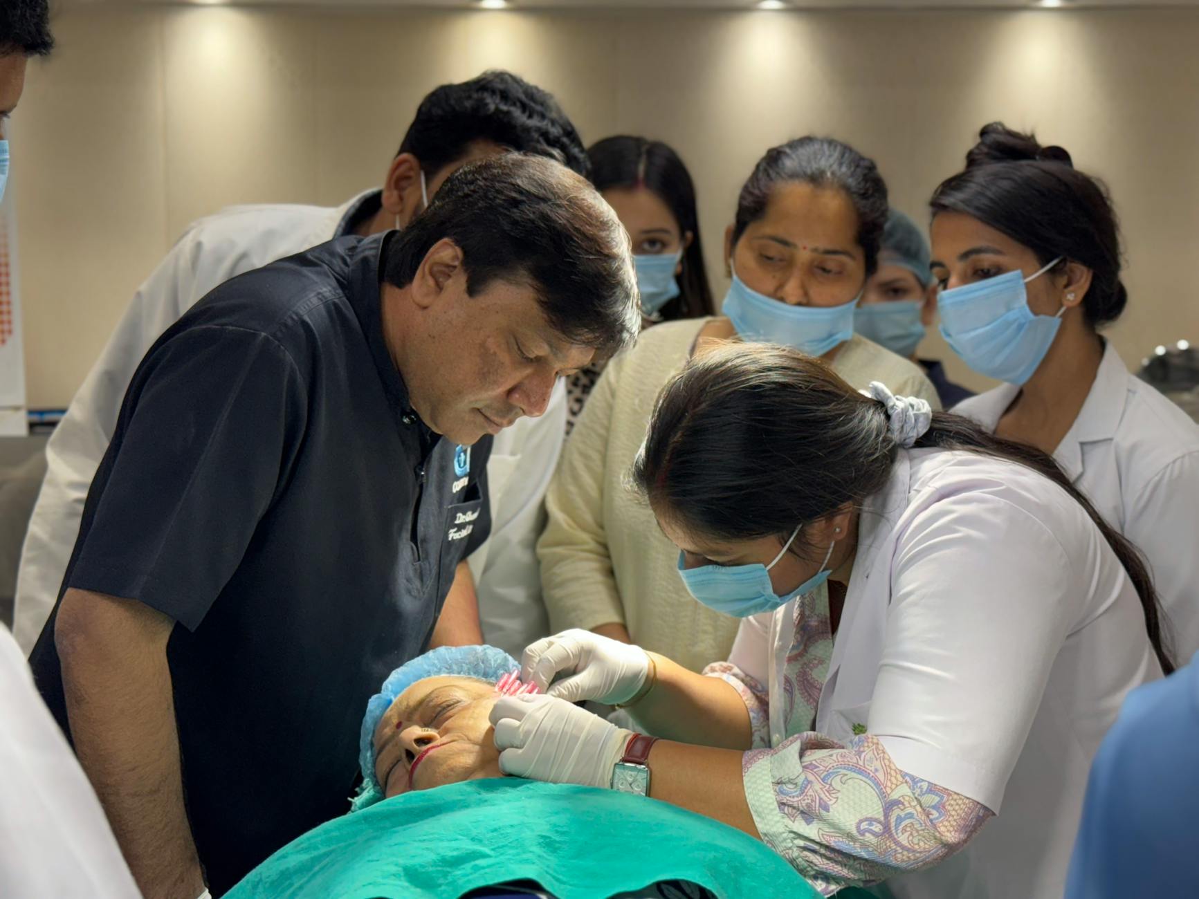 Healthcare professionals in a New Delhi clinic for medical preparation planning.