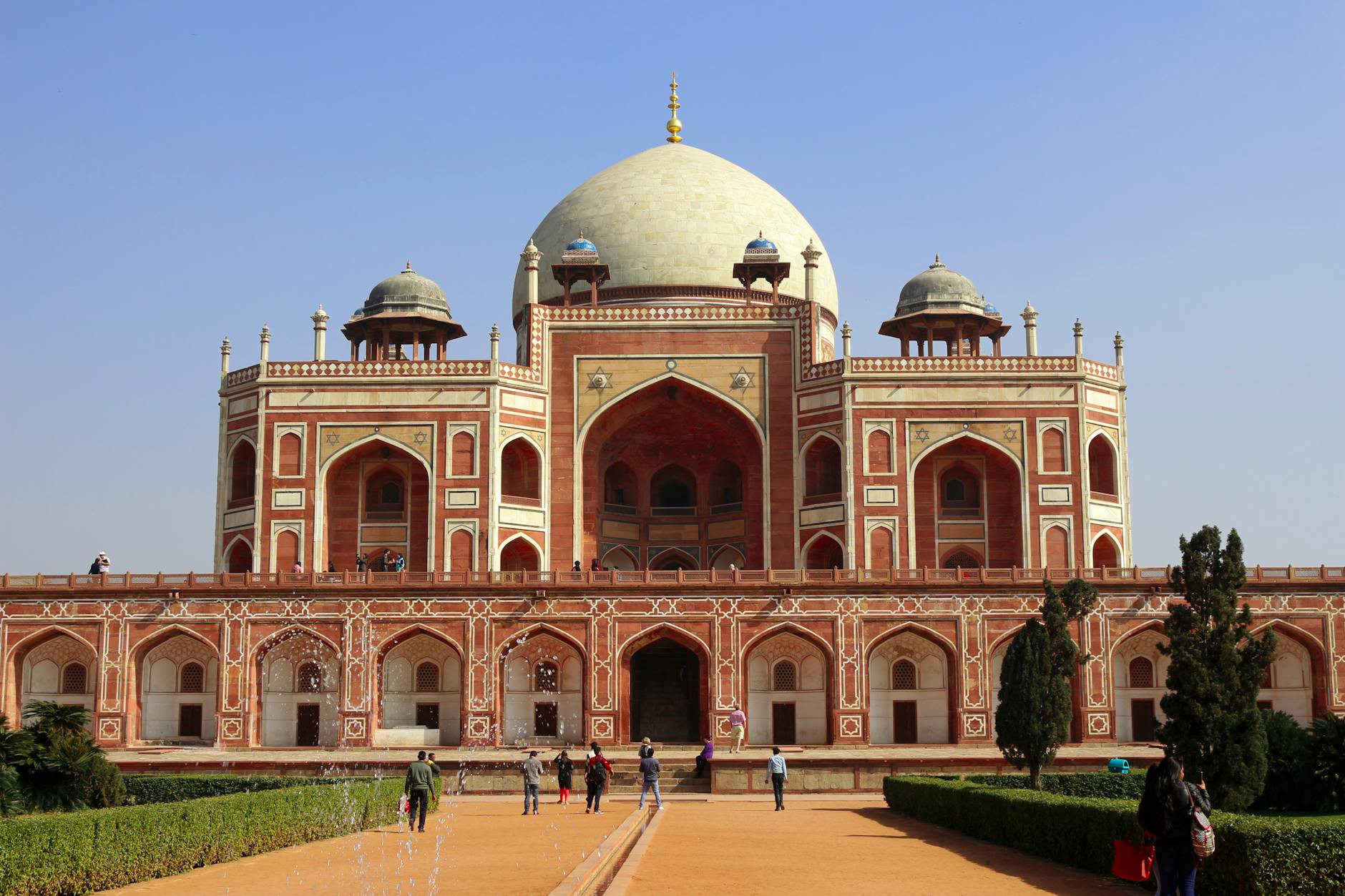 Visitors at Humayun's Tomb in New Delhi for woman traveler report planning.
