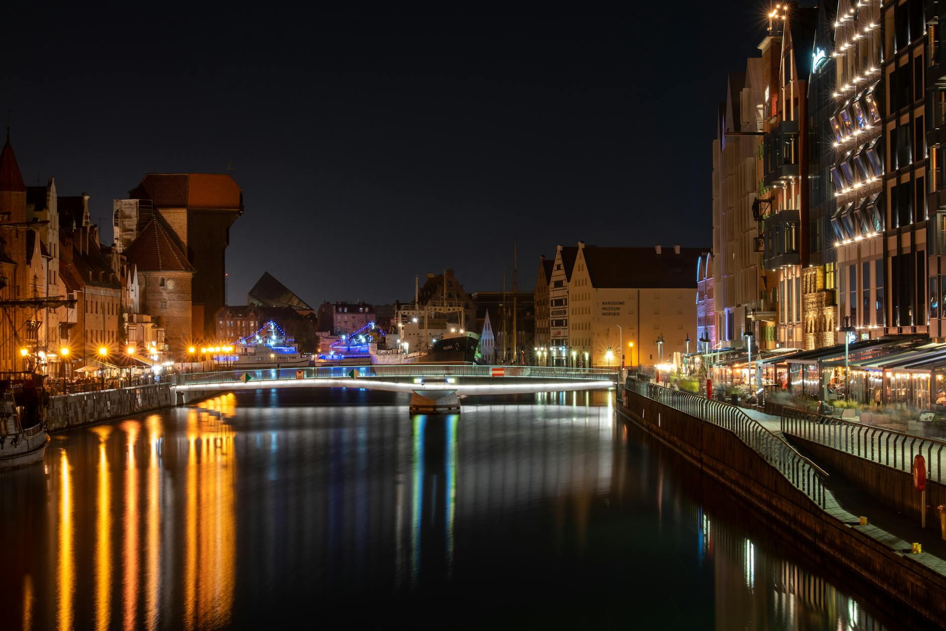 Gdansk evening street for woman traveler return planning.