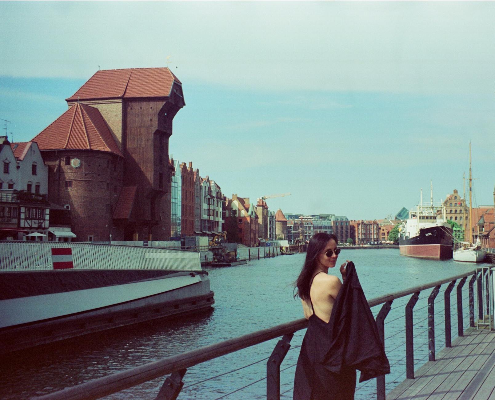 Gdansk woman traveler waterfront setting for short-stay planning.